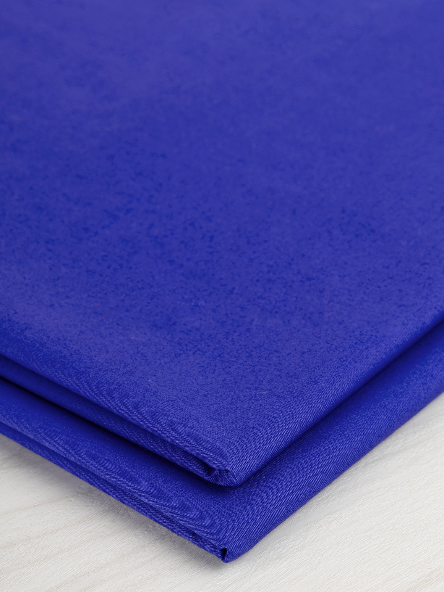 F-COT250-012-Signature-Crisp-Cotton-Poplin-Blue-Adventurine-Core-Fabrics-fold.JPG