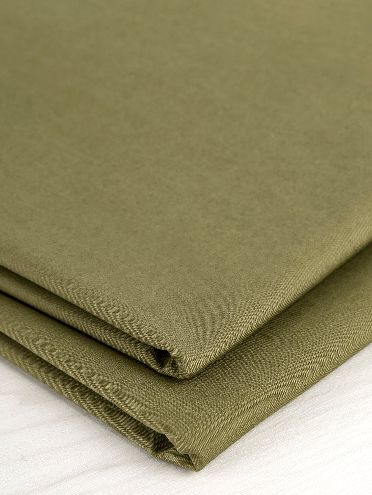F-COT250-010-Signature-Crisp-Cotton-Poplin-Olive-Core-Fabrics-fold.JPG