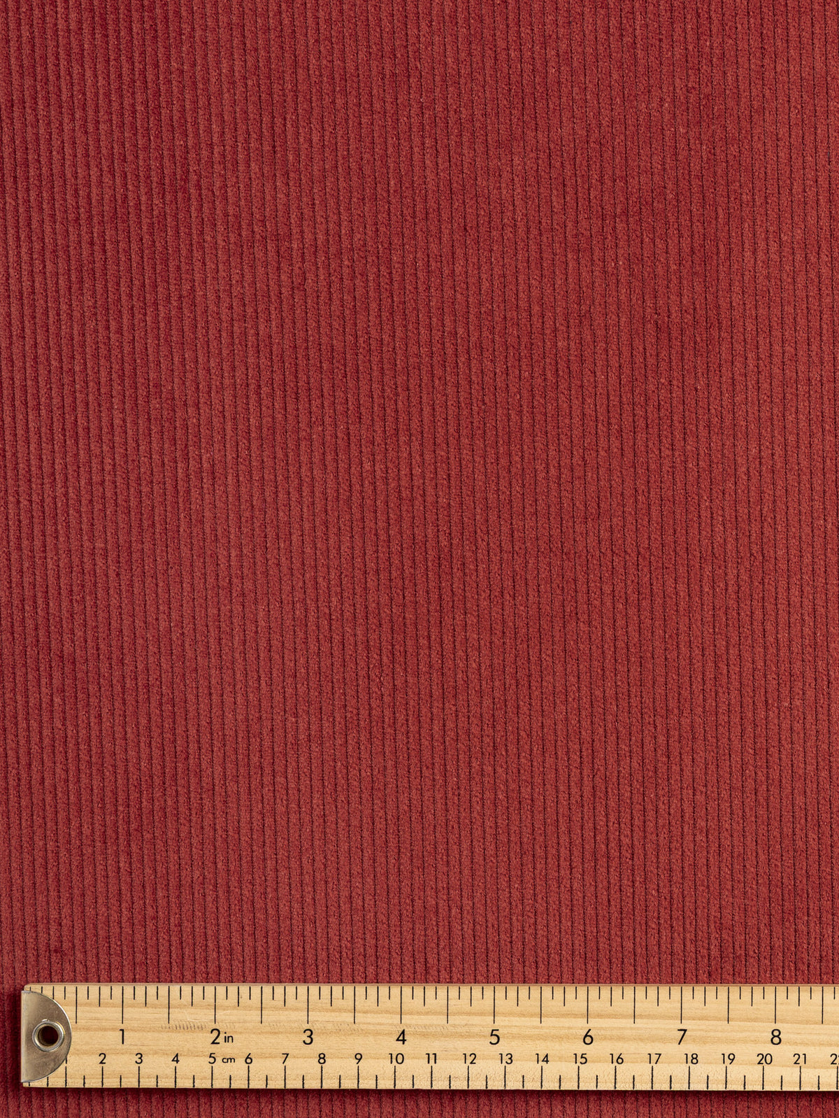 F-COT507-002-Slight-Stretch-8-Wale-Cotton-Corduroy-Garnet-Core-Fabrics-ruler.webp