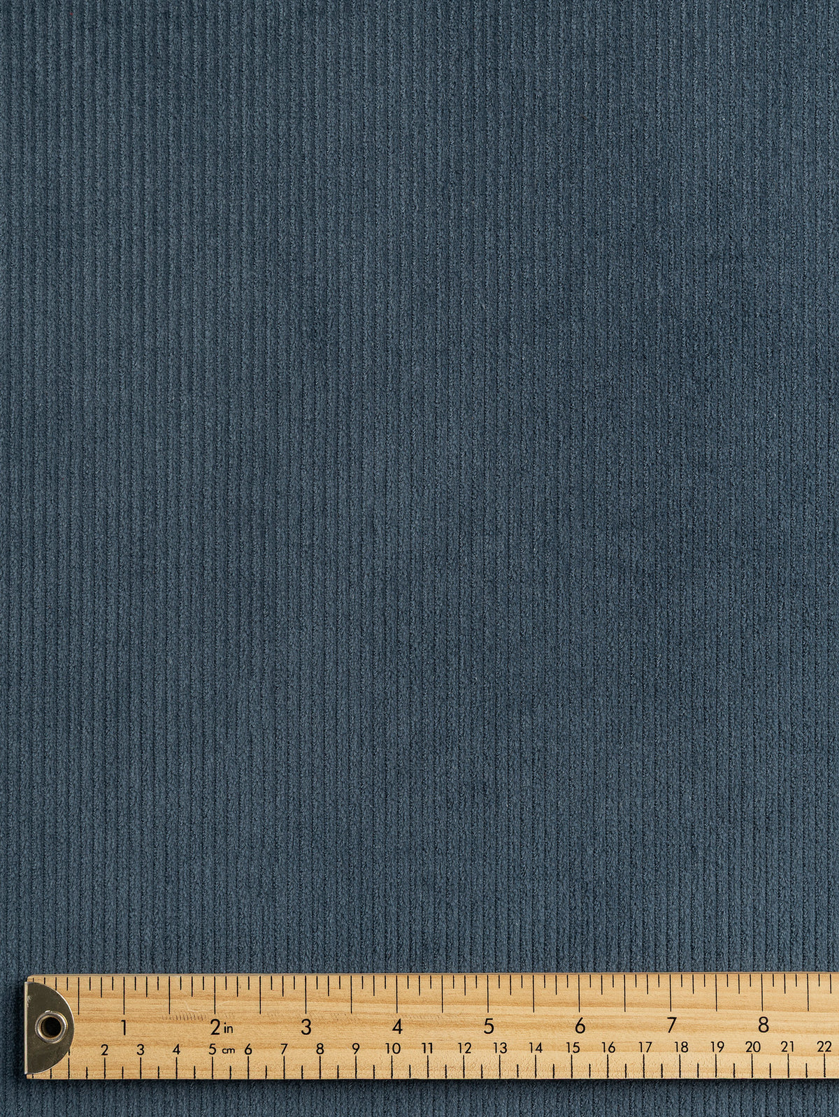 F-COT507-001-Slight-Stretch-8-Wale-Cotton-Corduroy-Slate-Core-Fabrics-ruler.webp