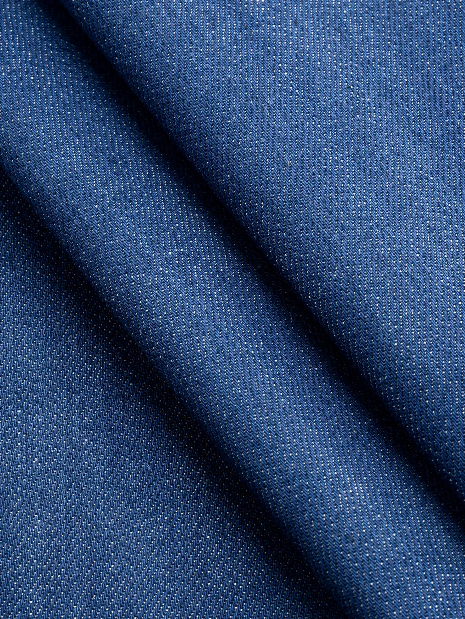 F-DEA247-Slight-Stretch-Cotton-Denim-Deadstock-Mid-Blue-Core-Fabrics-fold.webp