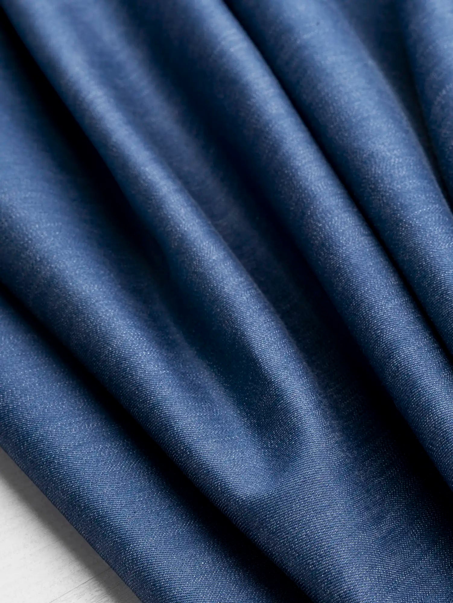 F-DEA247-Slight-Stretch-Cotton-Denim-Deadstock-Mid-Blue-Core-Fabrics-scrunched.webp