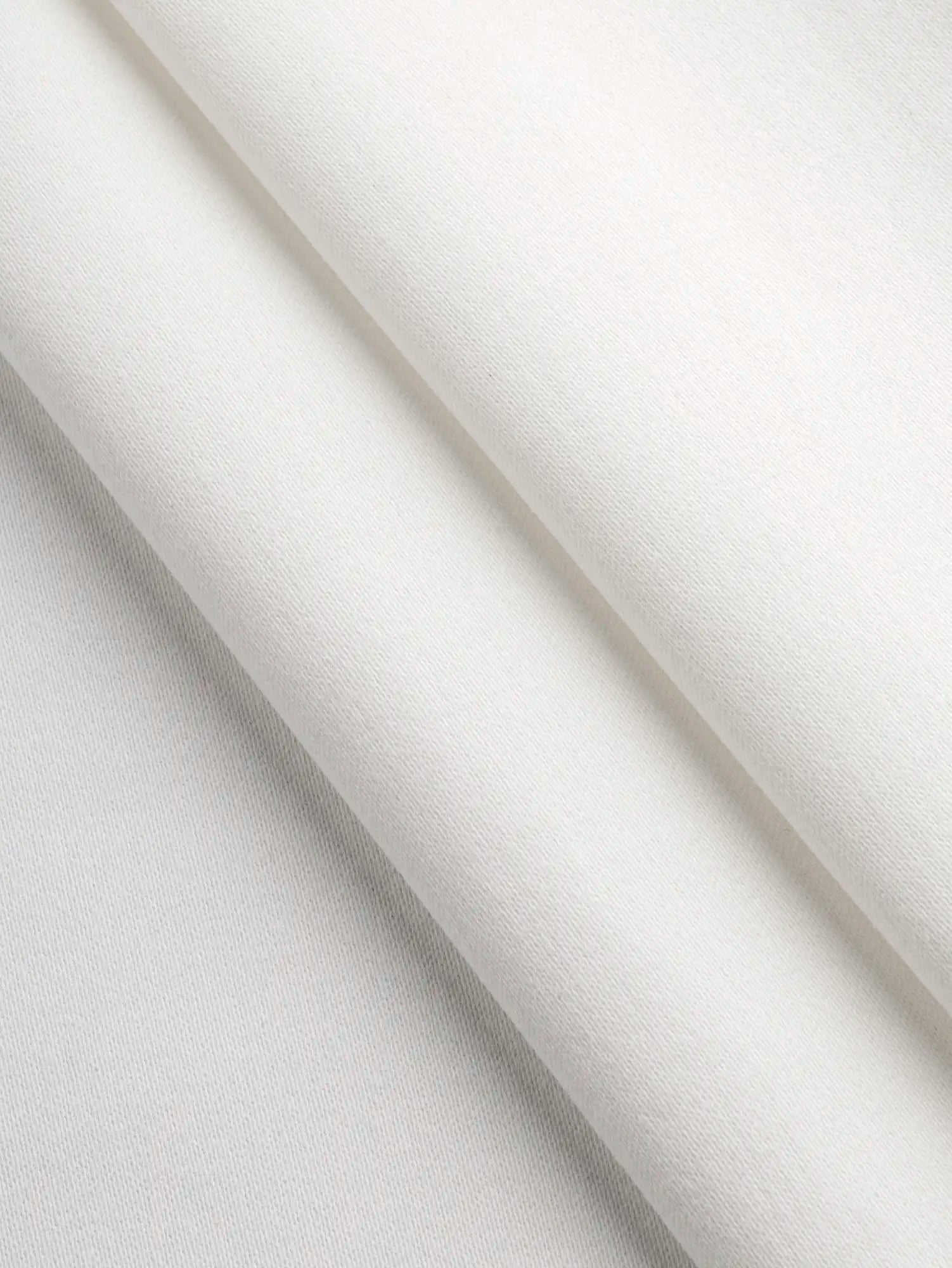 F-DEA226-Slight-Stretch-Cotton-Spandex-Bottomweight-Deadstock-Ivory-Core-Fabrics-fold.webp