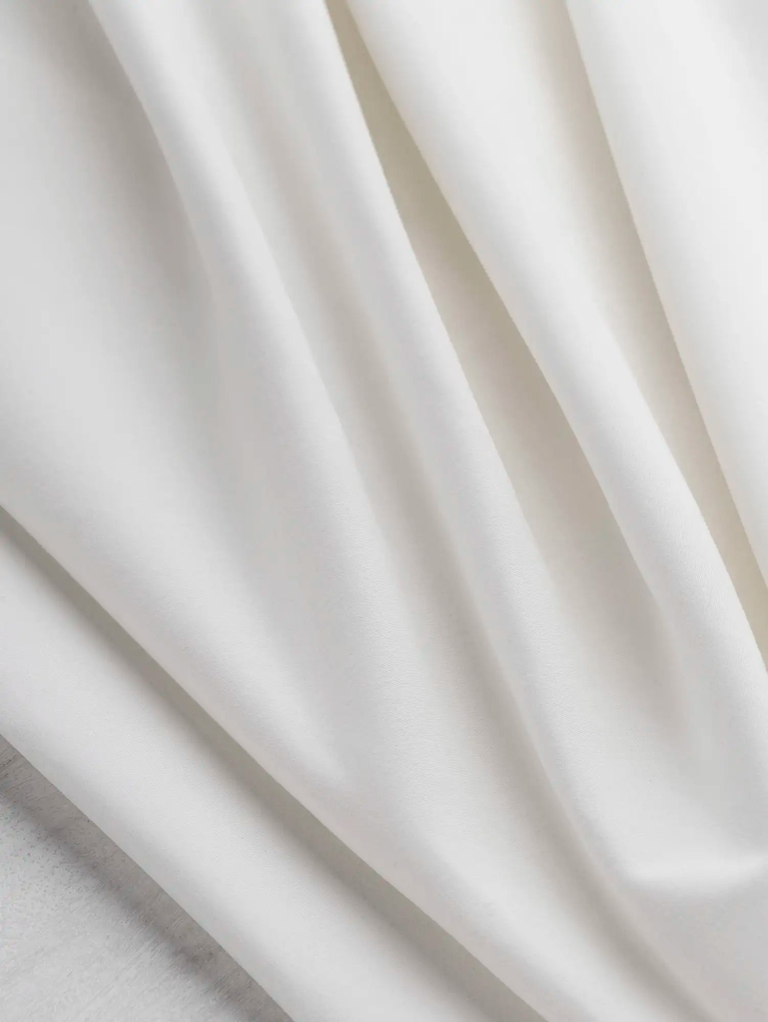F-DEA226-Slight-Stretch-Cotton-Spandex-Bottomweight-Deadstock-Ivory-Core-Fabrics-scrunched.webp