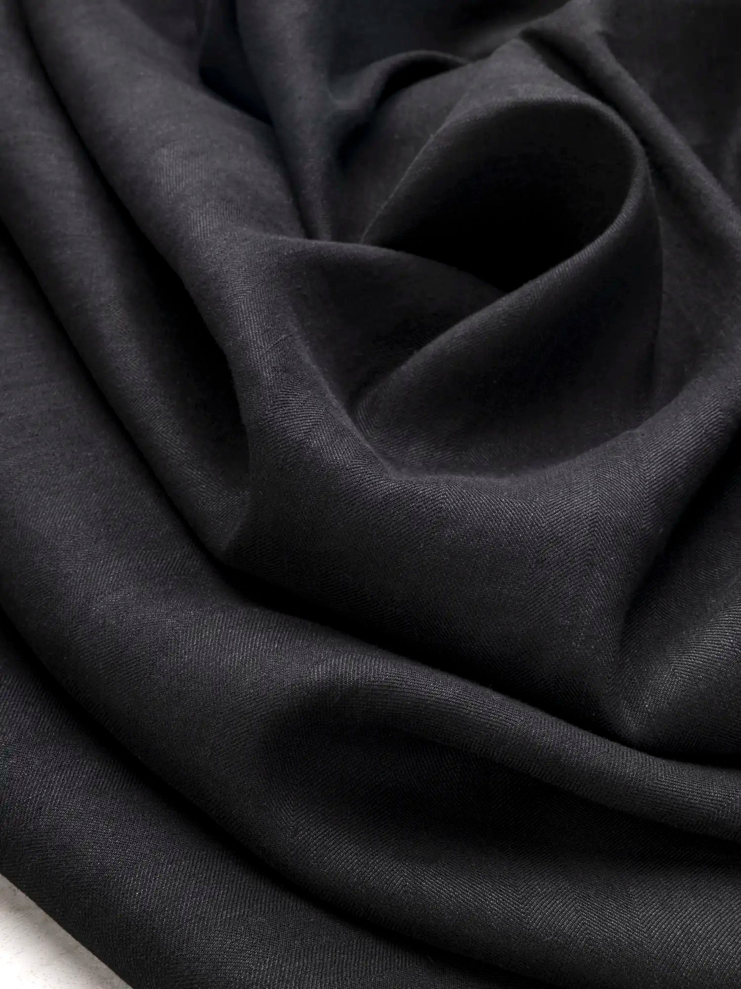 F-DEA172-001-Slight-Stretch-Herringbone-Cotton-Viscose-Suiting-Deadstock-Black-Core-Fabrics-scrunched.webp