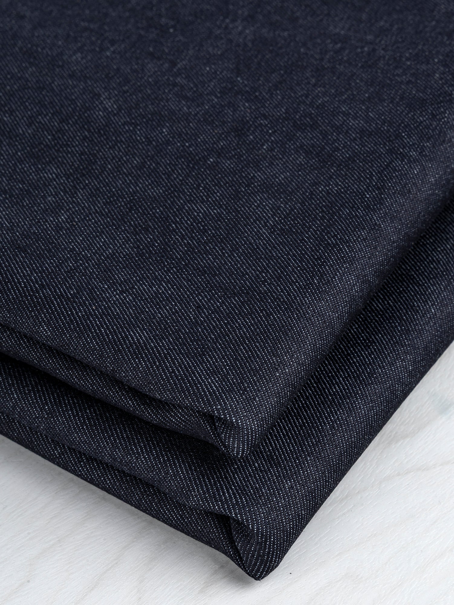 F-DEN035-Slight-Stretch-Midweight-Denim-Deadstock-Dark-Indigo-Core-Fabrics-fold.JPG