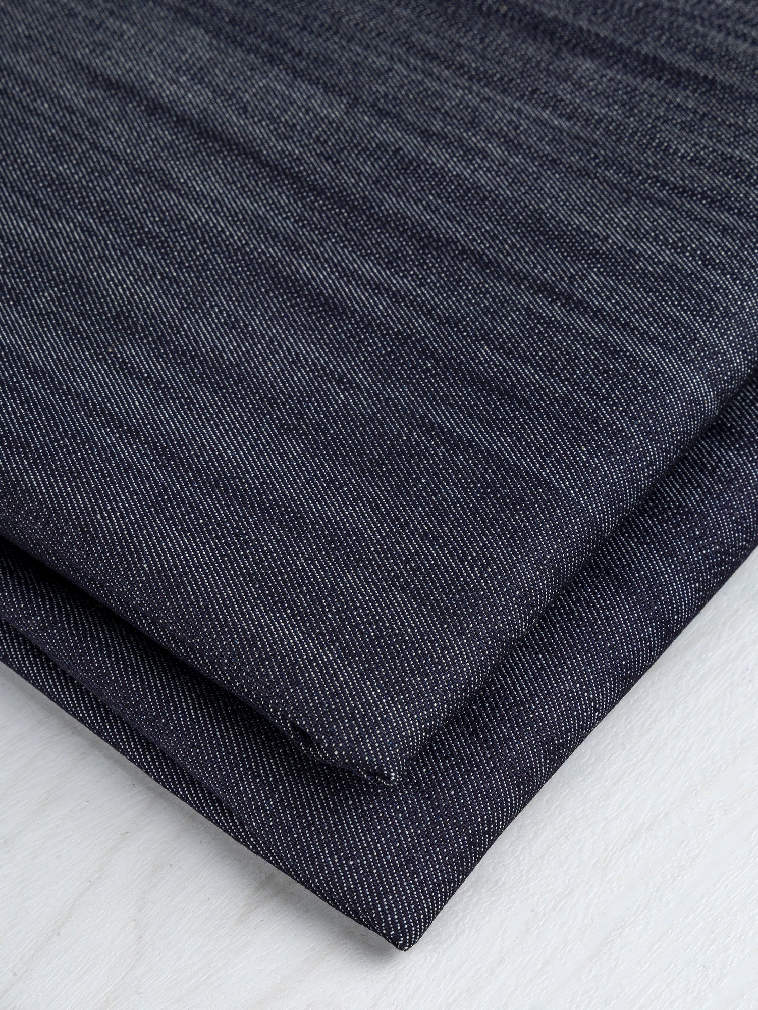 F-DEN034-Slight-Stretch-Striated-Midweight-Denim-Deadstock-Dark-Indigo-Core-fabircs-fold.JPG