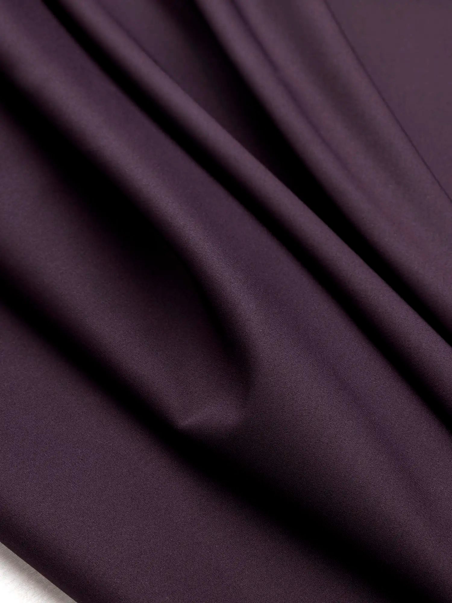 F-DEA174-Slight-Stretch-Viscose-Poly-Bottomweight-Deadstock-Plum-Core-Fabrics-scrunched.webp