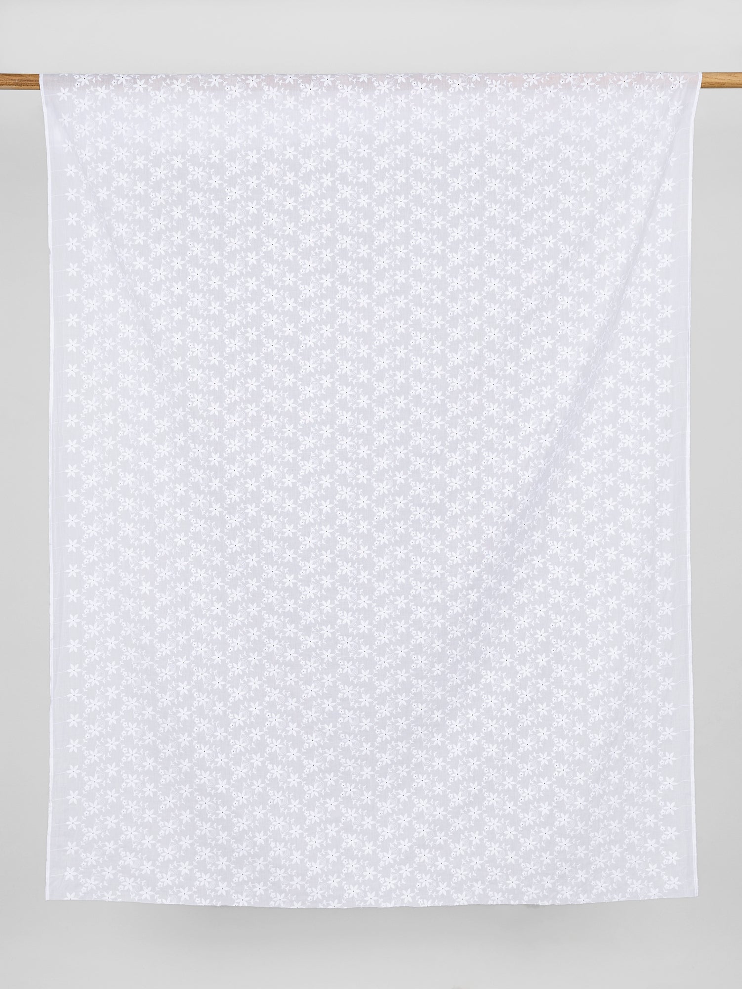 F-COT335-004-Small-Flower-Cotton-Eyelet-Deadstock-White-Core-Fabrics-draped
