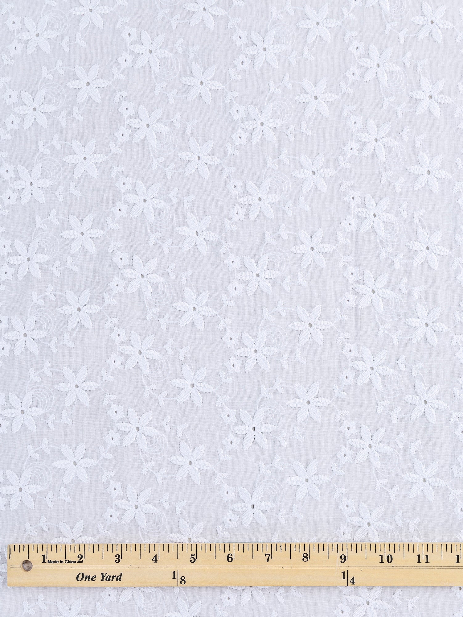 F-COT335-004-Small-Flower-Cotton-Eyelet-Deadstock-White-Core-Fabrics-ruler