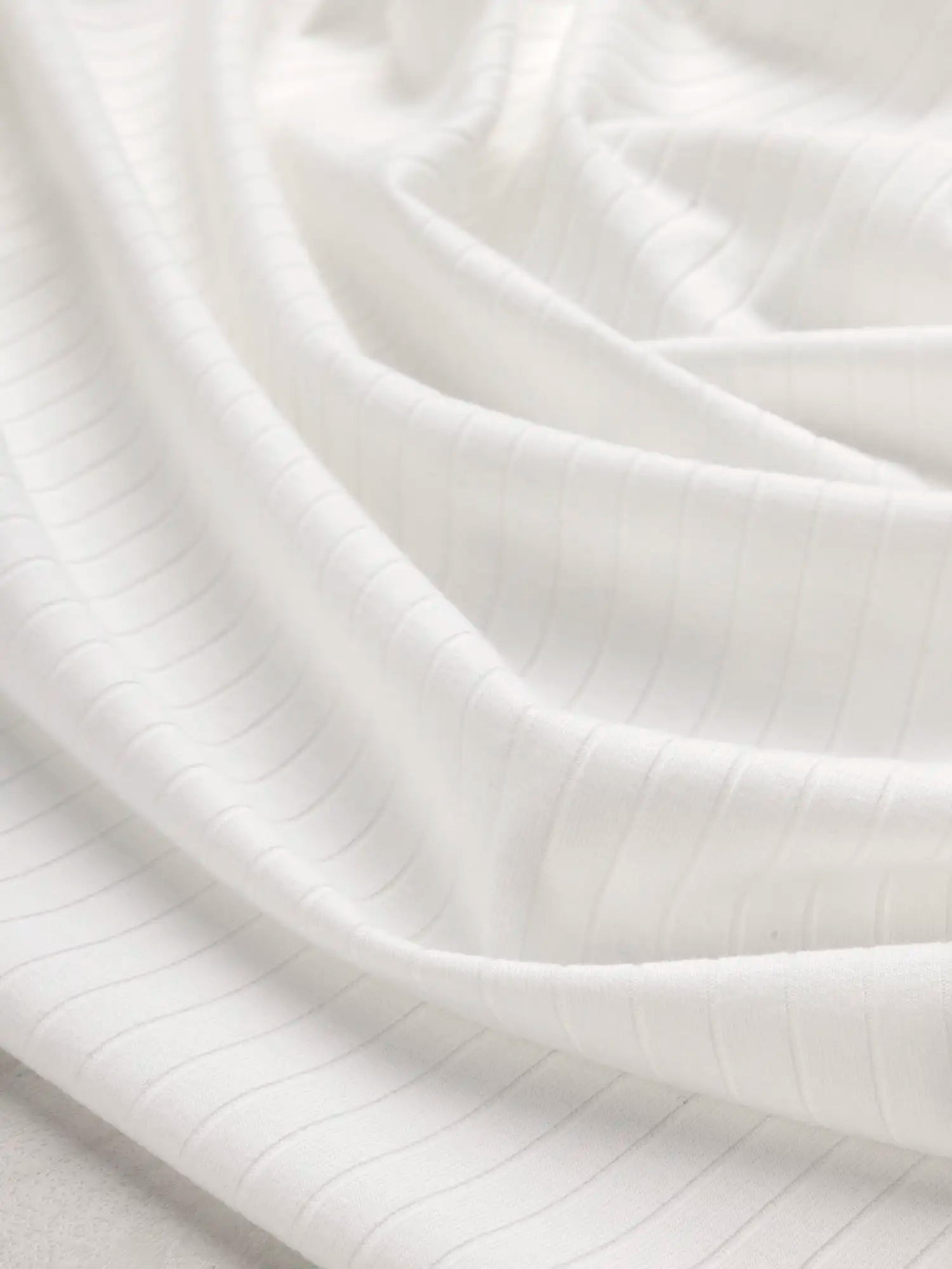 F-DEA179-Soft-Poly-Cotton-Rib-Knit-Deadstock-White-Core-Fabrics-scrunched.webp