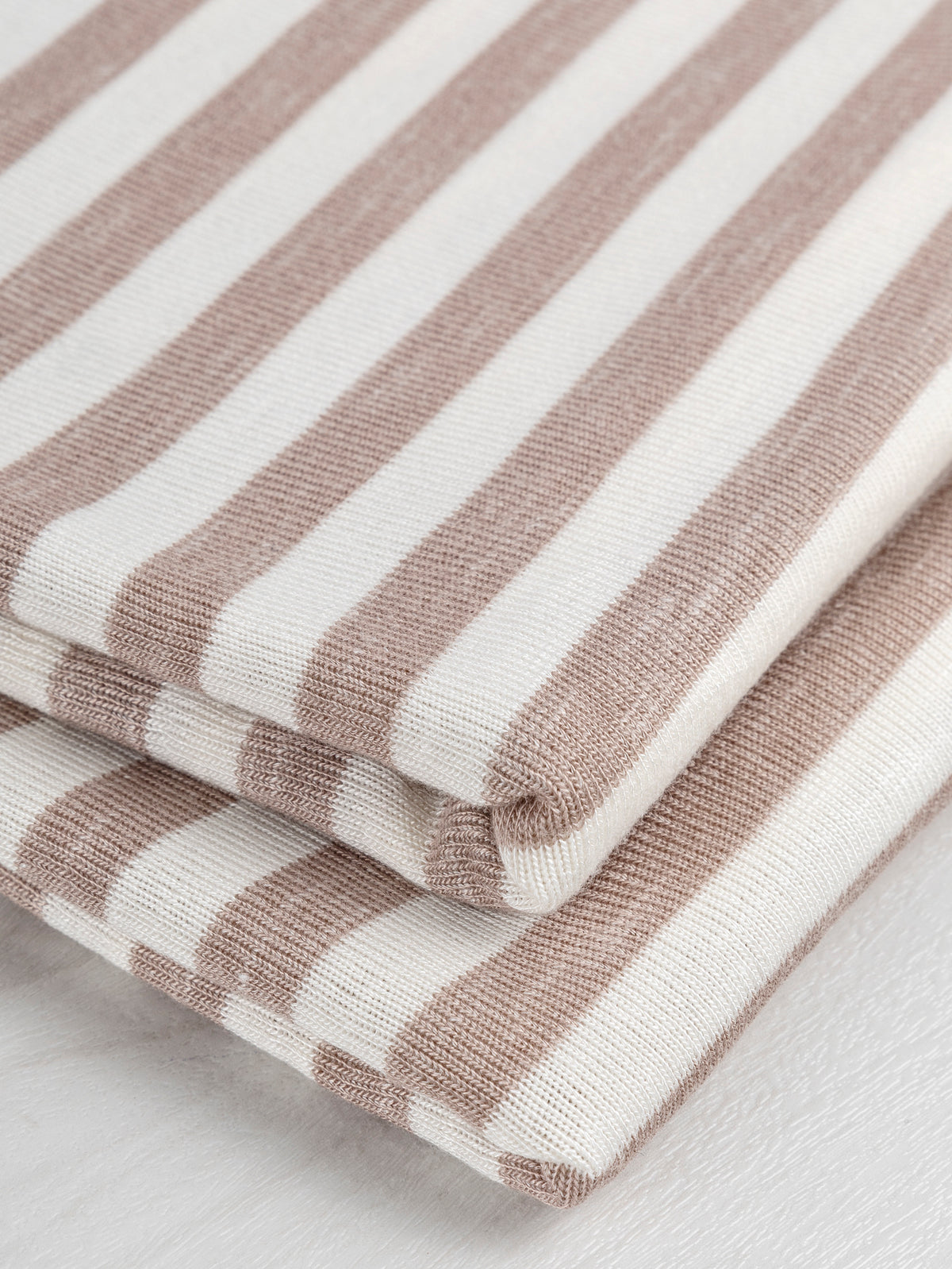 F-DEA019-Soft-Stripe-Viscose-Stretch-Knit-Deadstock-Beige-and-White-Core-Fabrics-fold.JPG