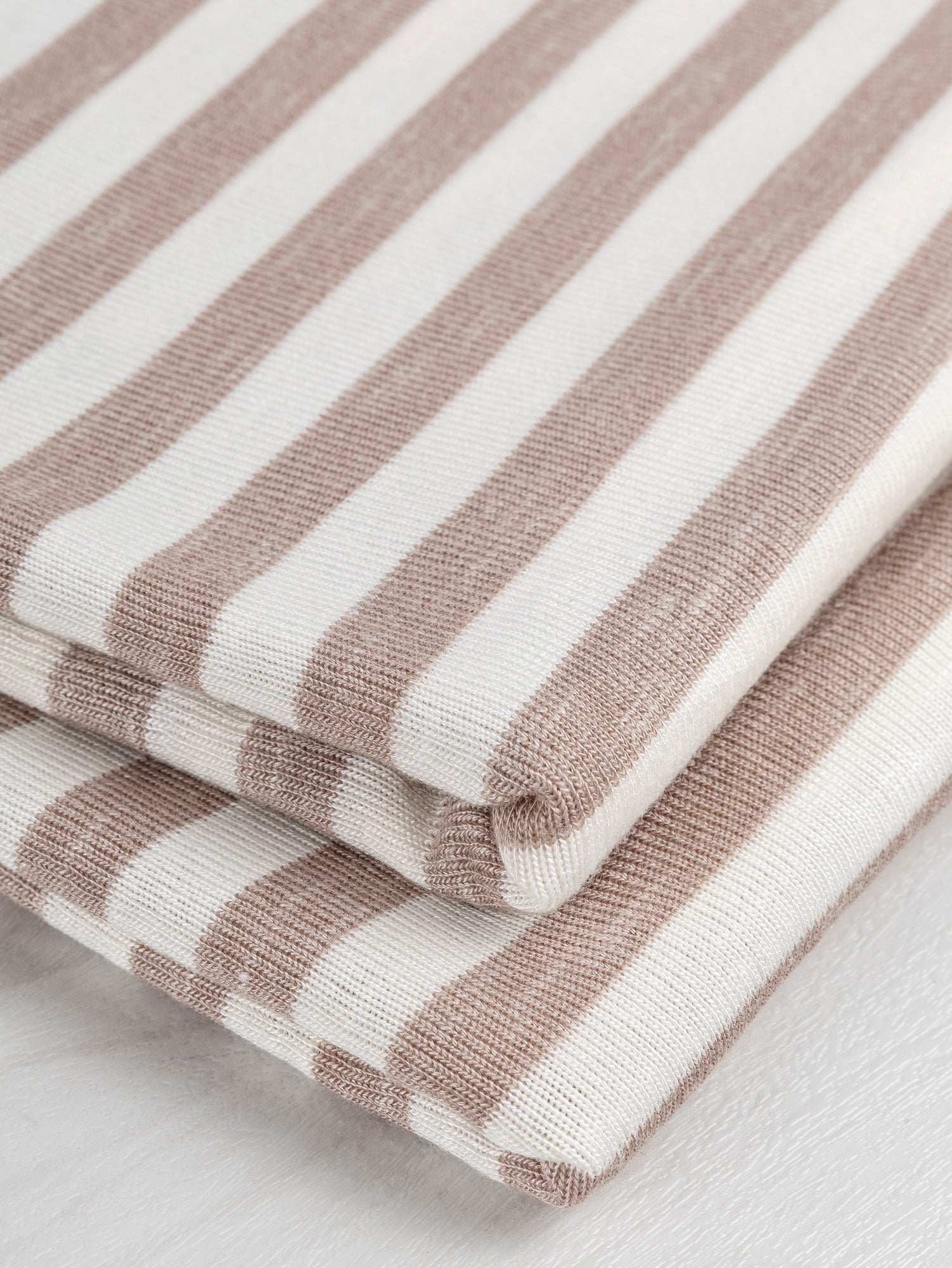 F-DEA019-Soft-Stripe-Viscose-Stretch-Knit-Deadstock-Beige-and-White-Core-Fabrics-fold.JPG