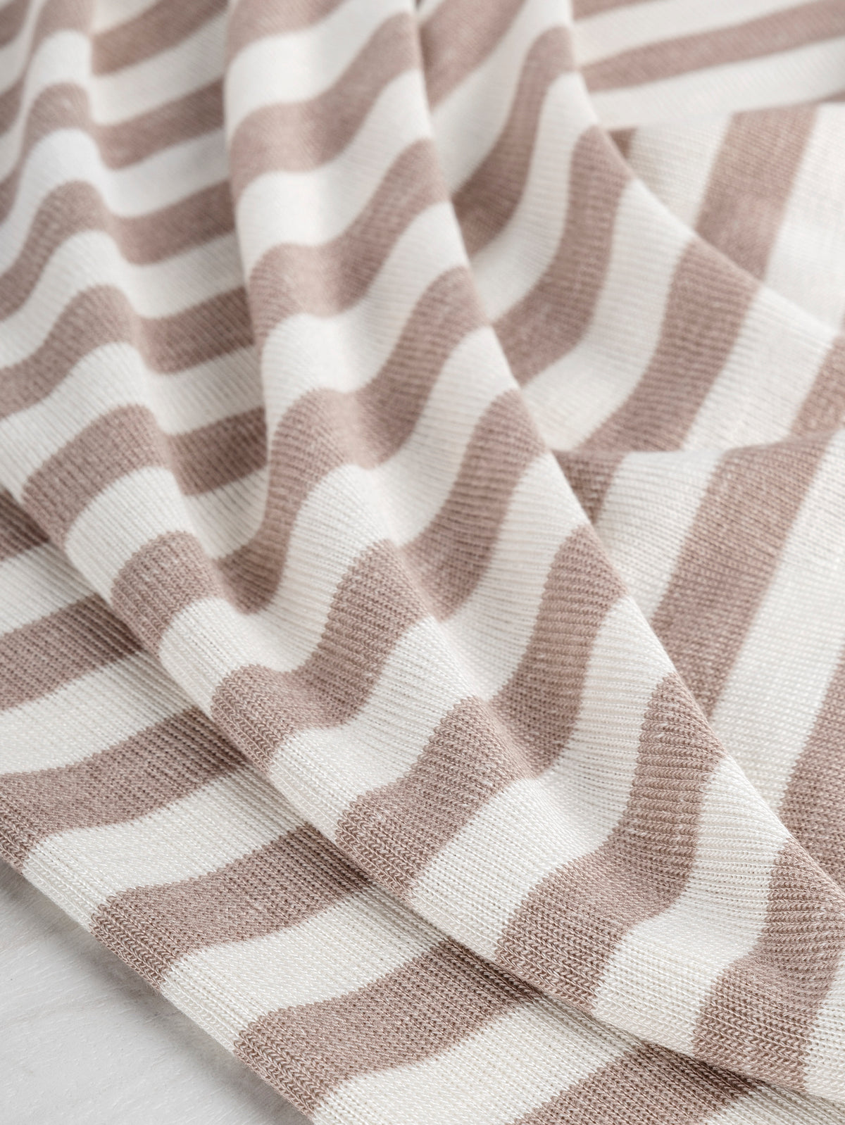 F-DEA019-Soft-Stripe-Viscose-Stretch-Knit-Deadstock-Beige-and-White-Core-Fabrics-scrunched.JPG