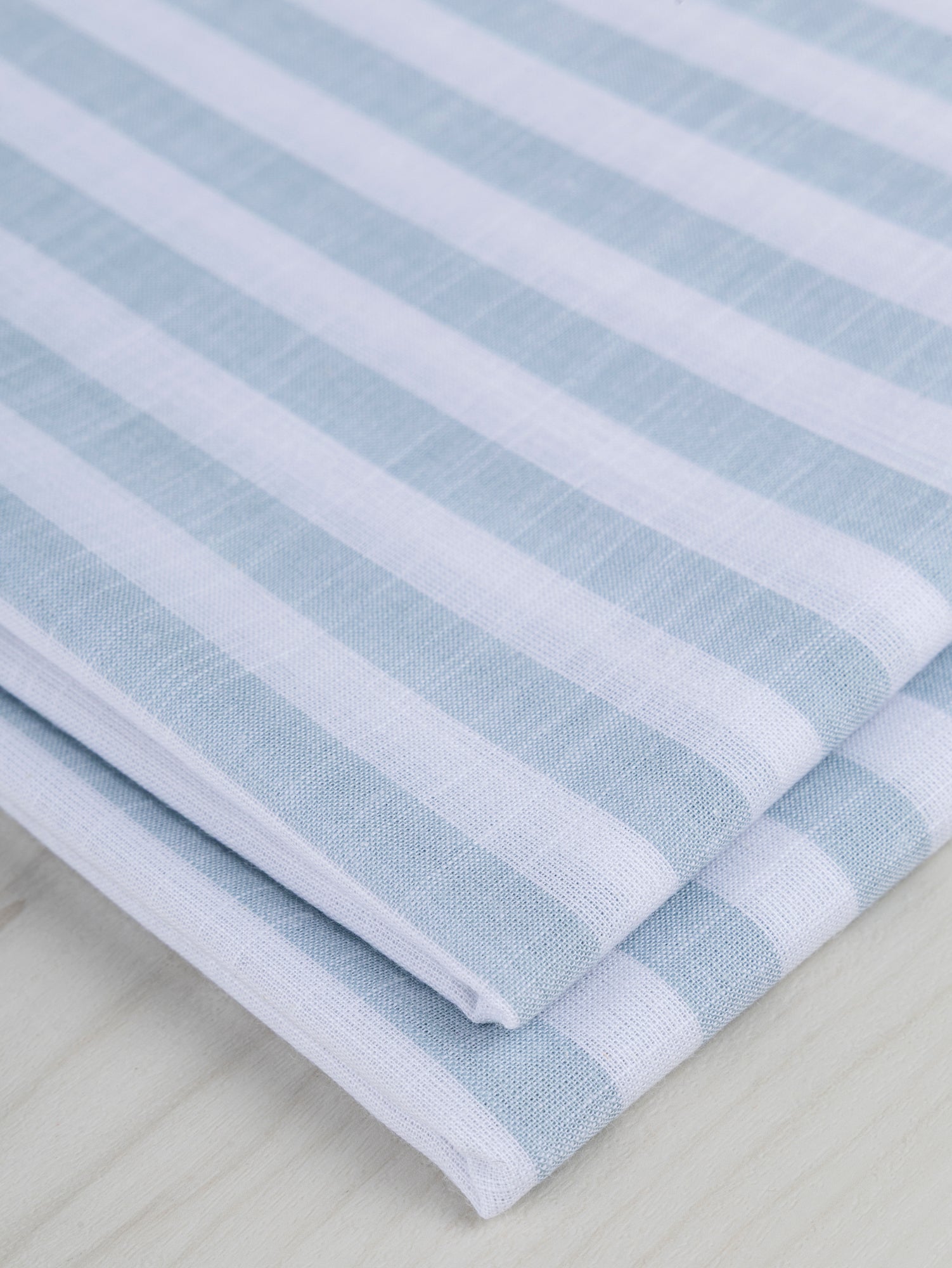 F-COT371-001-Softened-Striped-Cotton-Shirting-Light-Blue+White-Core-Fabrics-fold.JPG