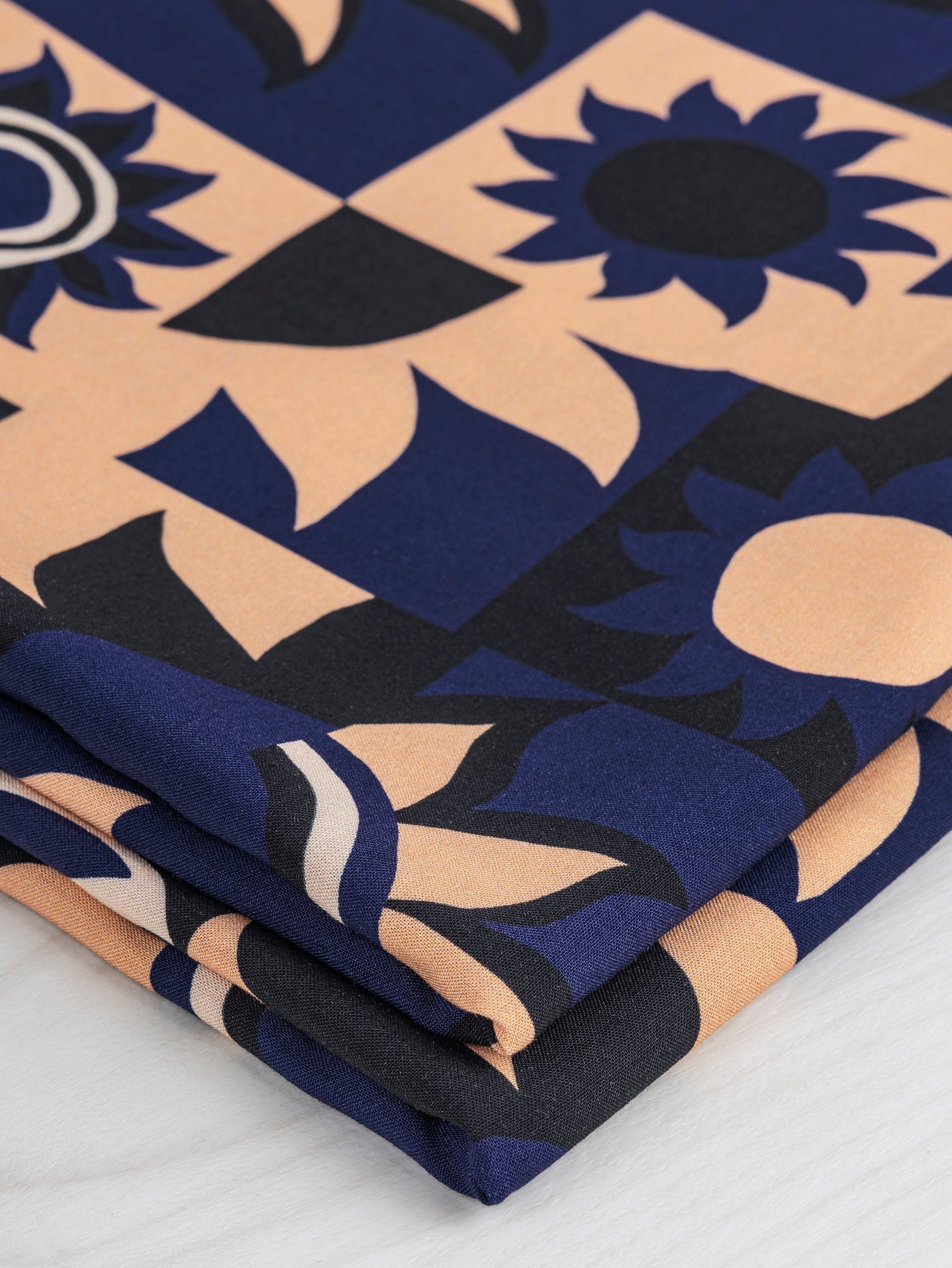 F-VIS230-Solar-Mosaic-Print-Ecovero-Viscose-Black-Navy-Tan-Core-Fabrics-fold