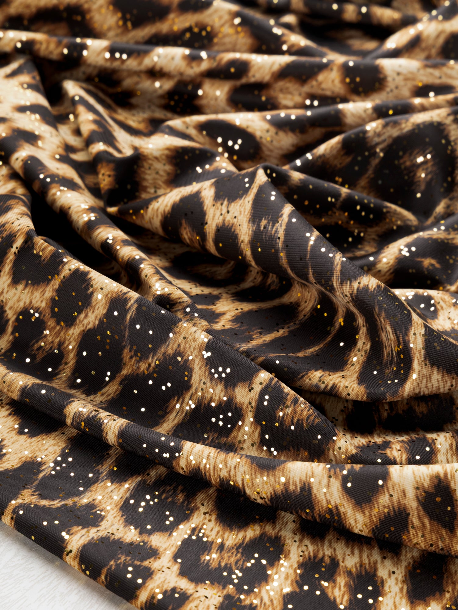 F-DEA105-Sparkle-Leopard-Stretch-Knit-Gold-and-Black-Core-Fabrics-scrunched.JPG