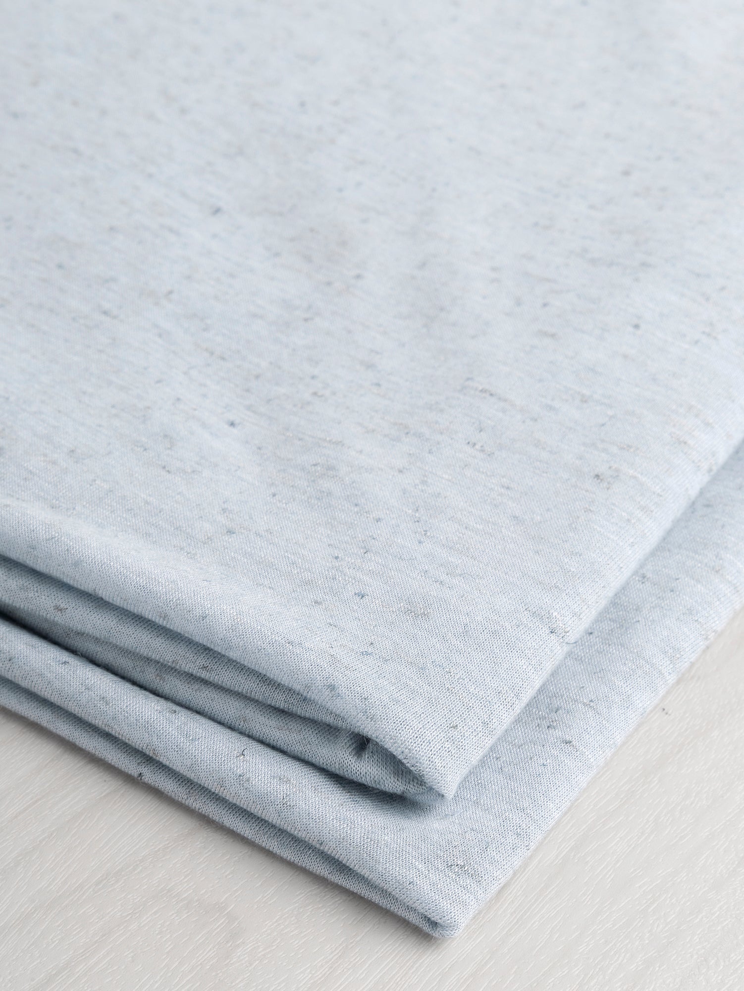 F-DEA064-002-Speckle-Cotton-Jersey-Deadstock-Light Blue-Core-Fabrics-fold.JPG