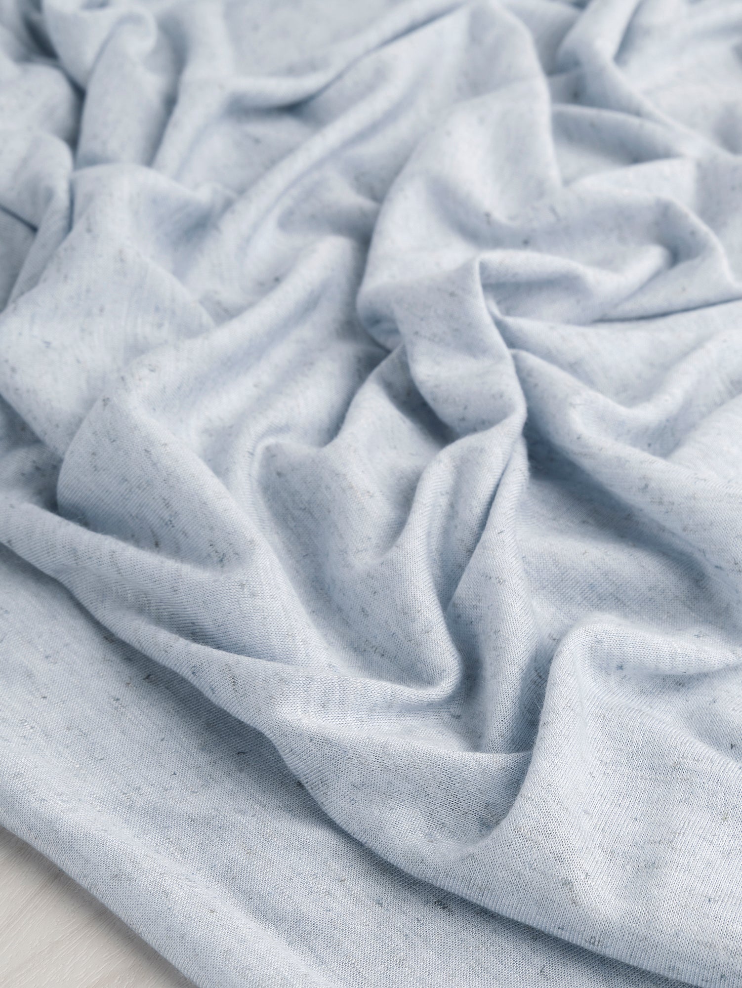 F-DEA064-002-Speckle-Cotton-Jersey-Deadstock-Light Blue-Core-Fabrics-scrunched.JPG