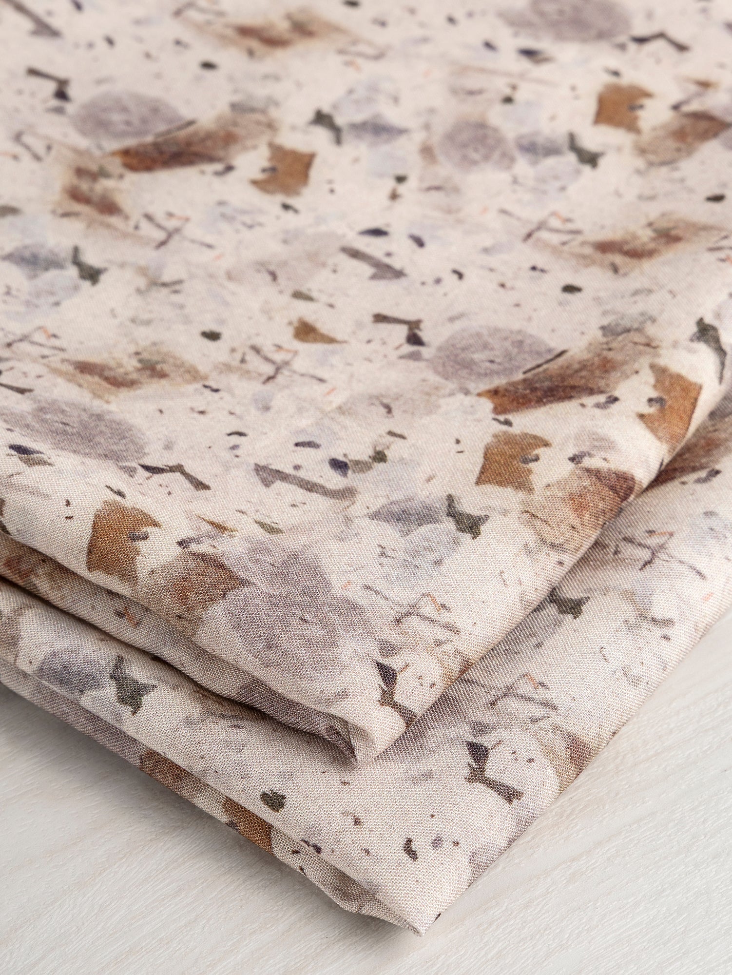 F-DEA032-Speckle-Marble-Print-Viscose-Deadstock-Beige-Brown-and-Grey-Core-Fabrics-fold.JPG