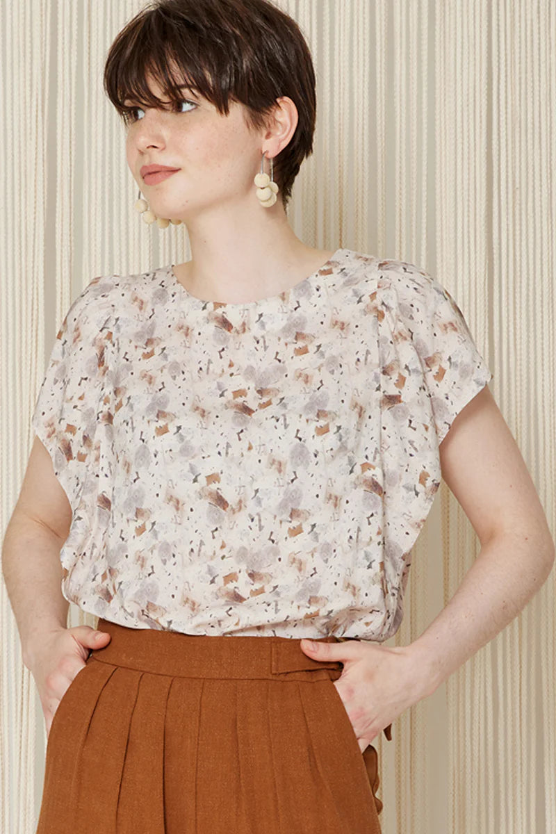 F-DEA032-Speckle-Marble-Print-Viscose-Deadstock-Beige-Brown-and-Grey-Core-Fabrics-model.webp