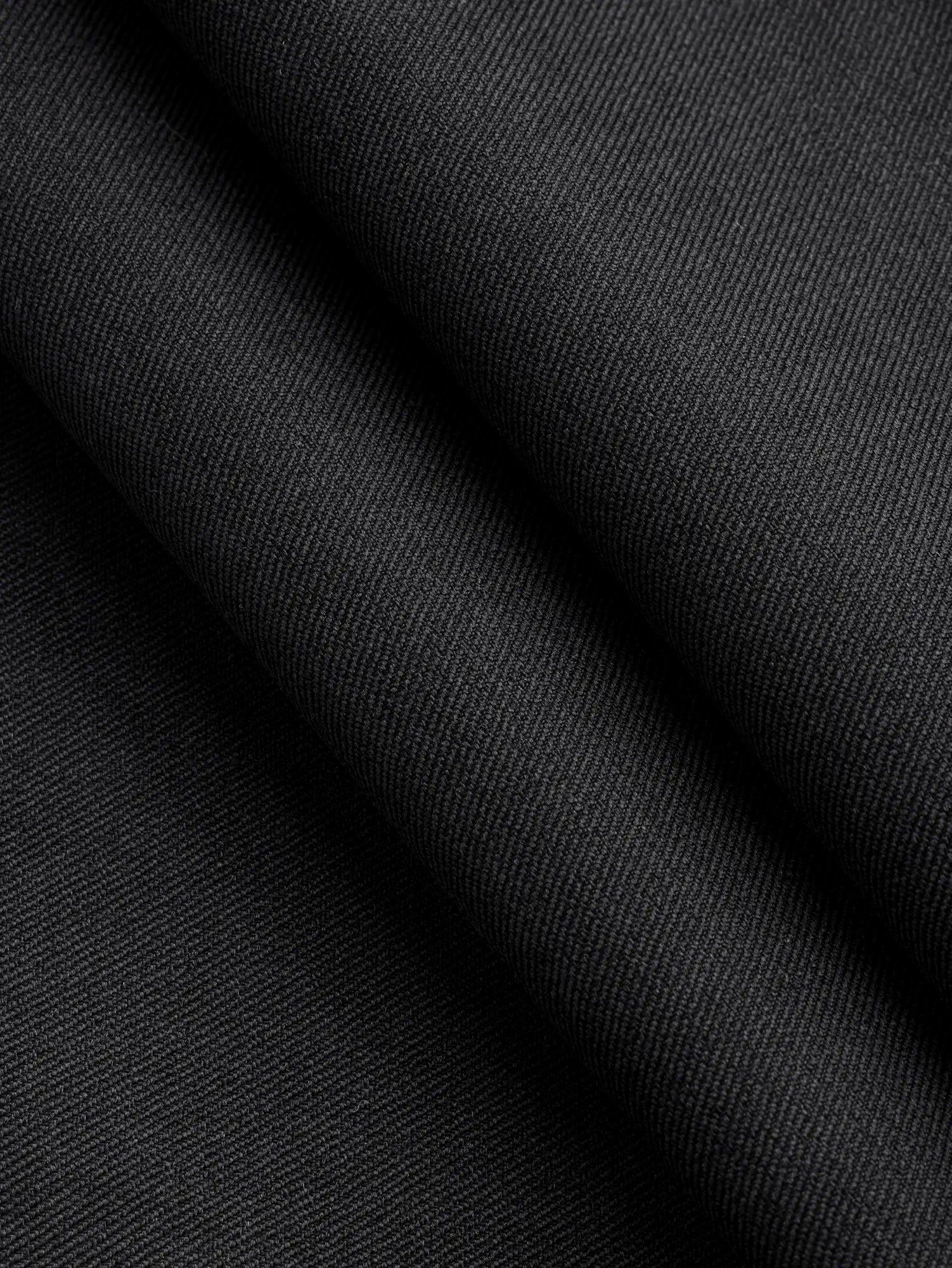 F-DEA246-Stretch-Cotton-Spandex-Twill-Deadstock-Black-Core-Fabrics-fold.webp