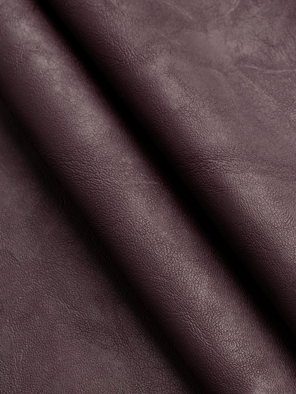 F-DEA261-Stretch-Faux-Leather-Deadstock-Burgundy-Core-Fabrics-fold.webp