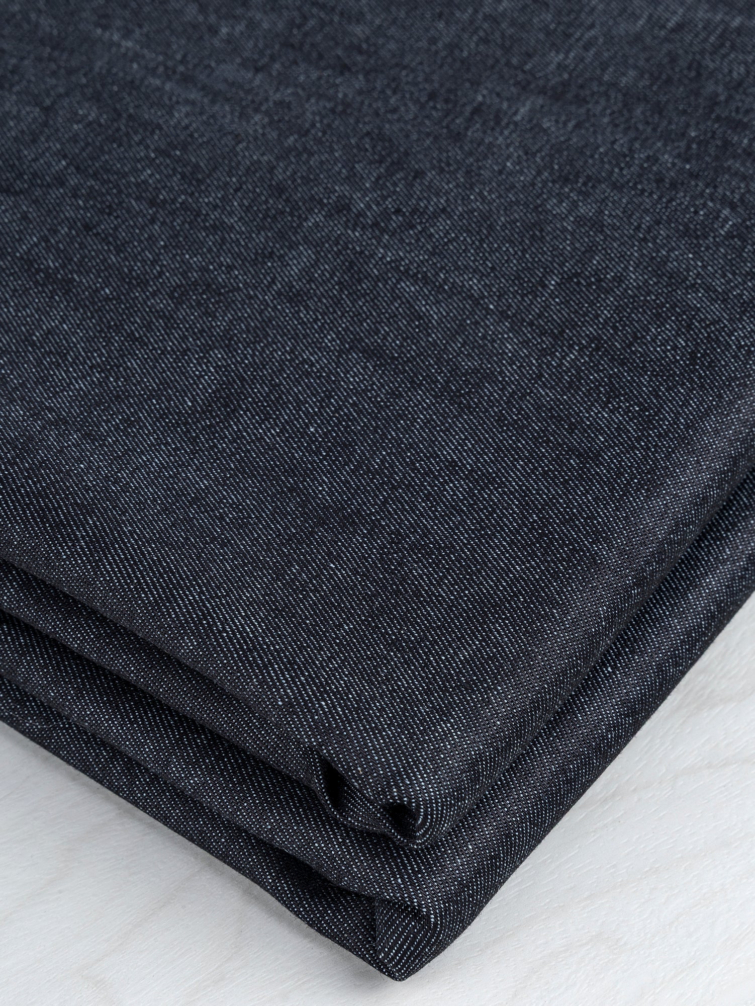 【DISCERNMENT】One-tuck black dart denim (green fabric) Stretch Midweight Denim Deadstock - Midnight | Core Fabrics