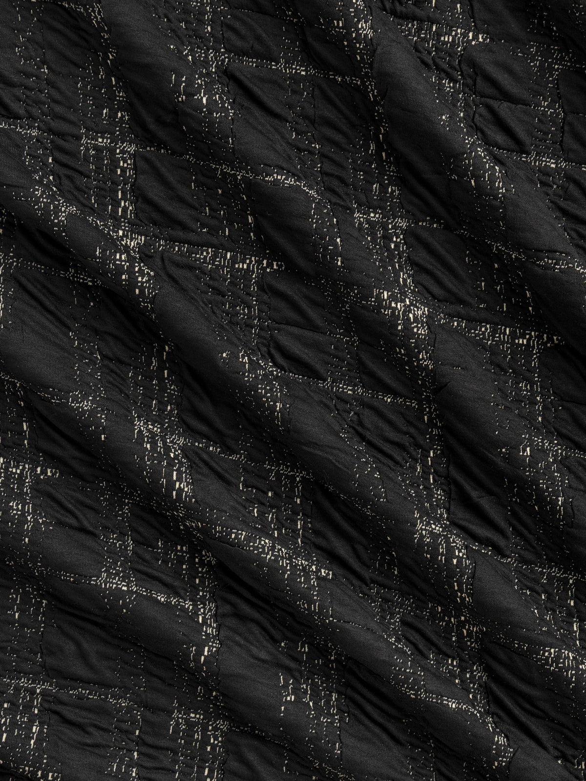 F-DEA256-001-Stretch-Quilted-Jacquard-Knit-Deadstock-Black-Core-Fabrics-scrunched.webp