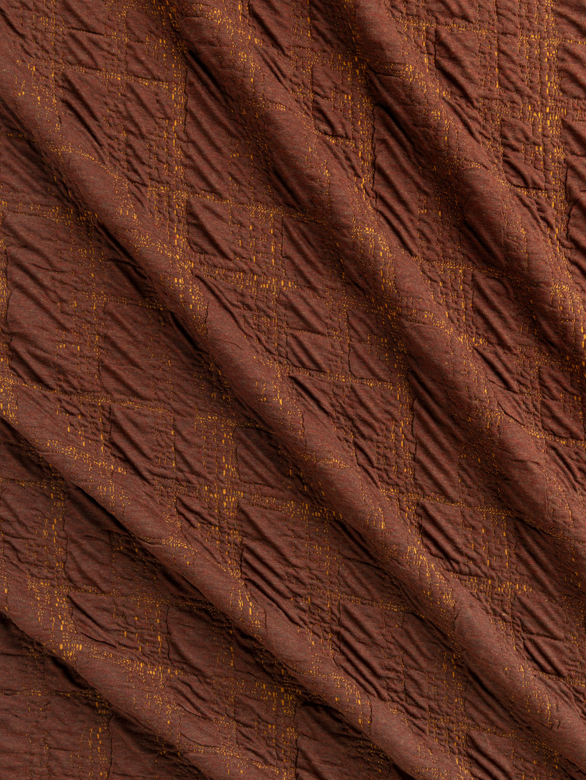 F-DEA256-003-Stretch-Quilted-Jacquard-Knit-Deadstock-Mahogany-Core-Fabrics-scrunched.webp