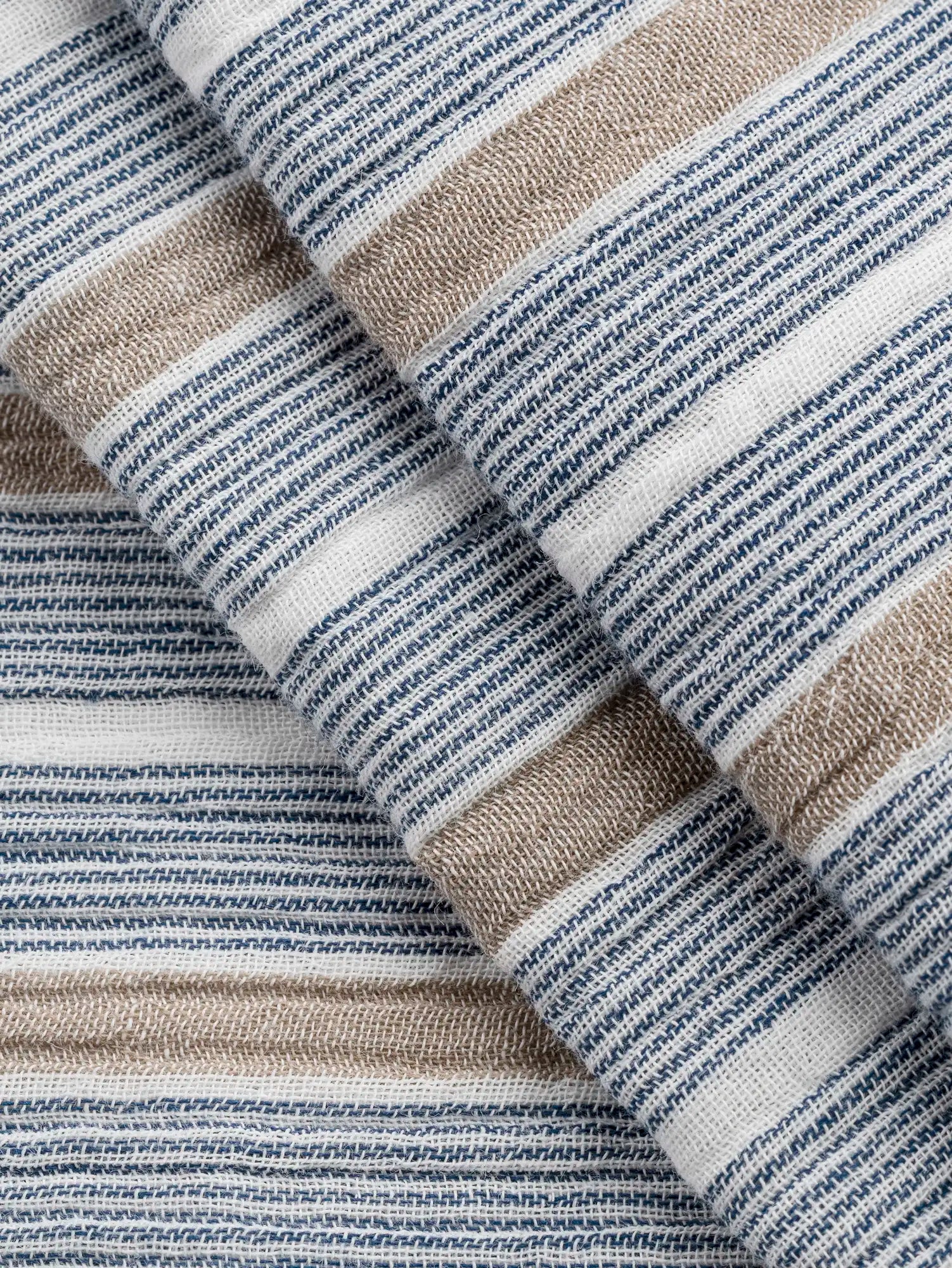 F-COT463-002-Stripe-Cotton-Double-Gauze-White-Indigo-and-Sand-Core-Fabrics-fold.webp