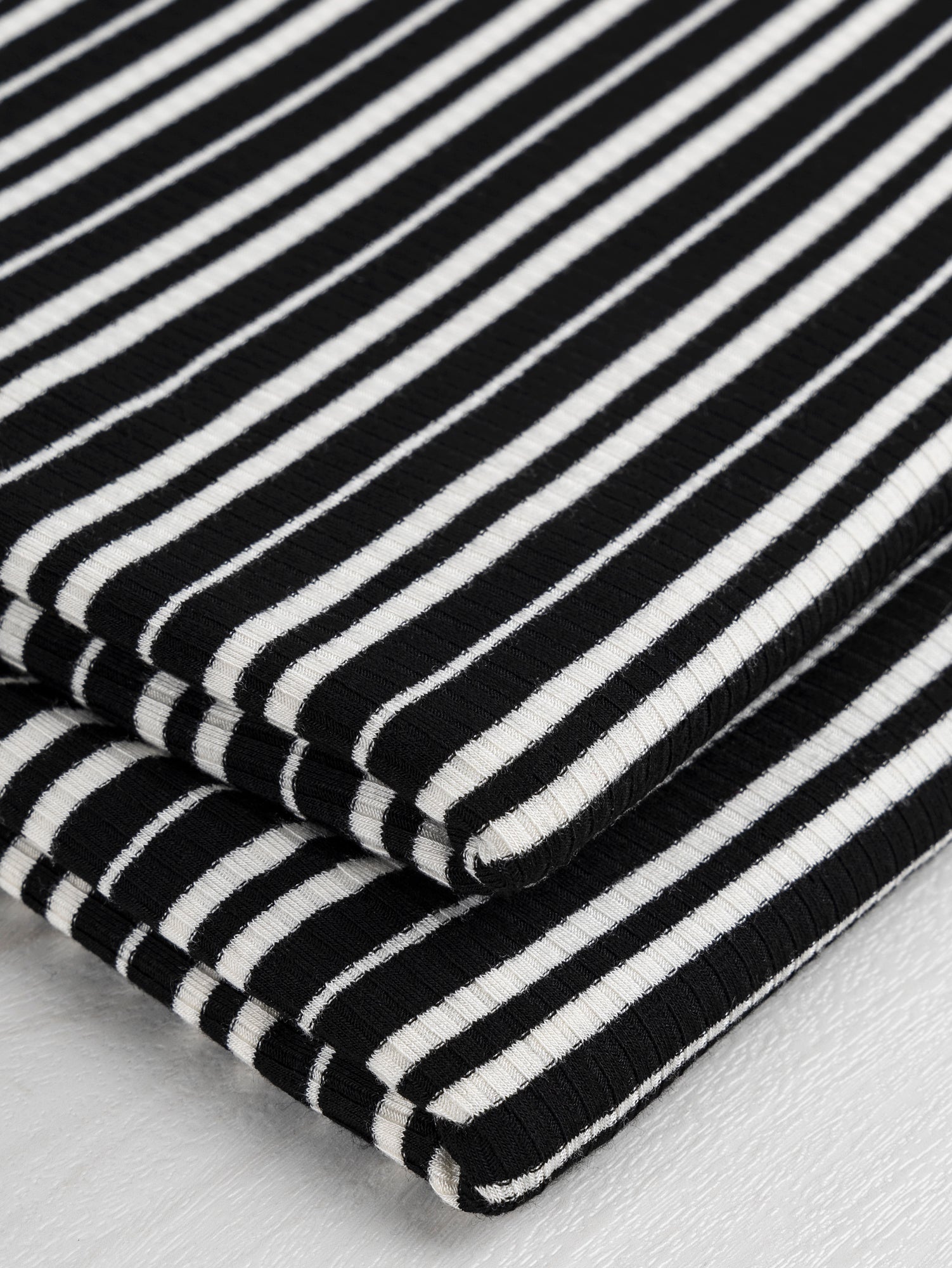 F-DEA021-Stripe-Cotton-Jersey-Rib-Knit-Deadstock-Black-and-White-Core-Fabrics-fold.JPG