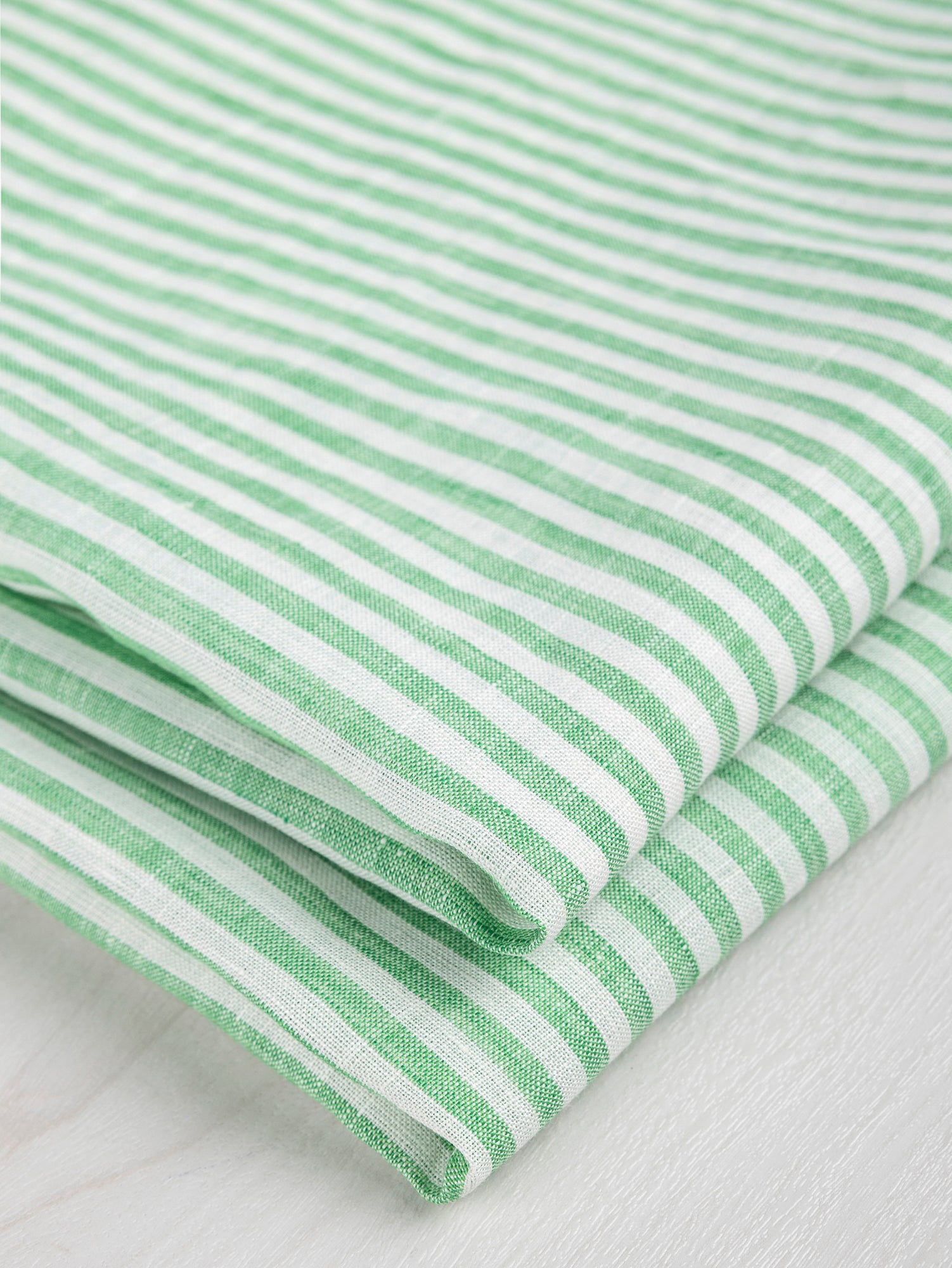 F-LIN043-001-Striped-Linen-Shirting-Green-and-White-Core-Fabrics-fold.JPG