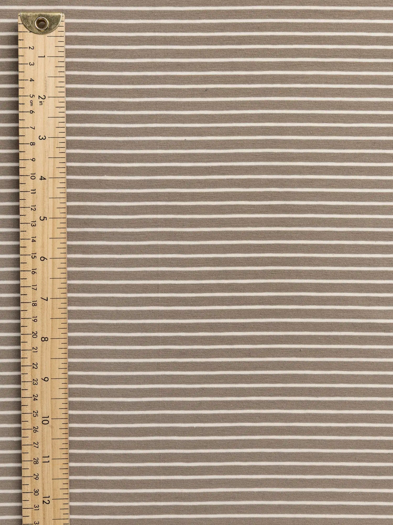 F-DEA155-Striped-Stretch-Jersey-Deadstock-Tan-and-Cream-Core-Fabrics-ruler.webp