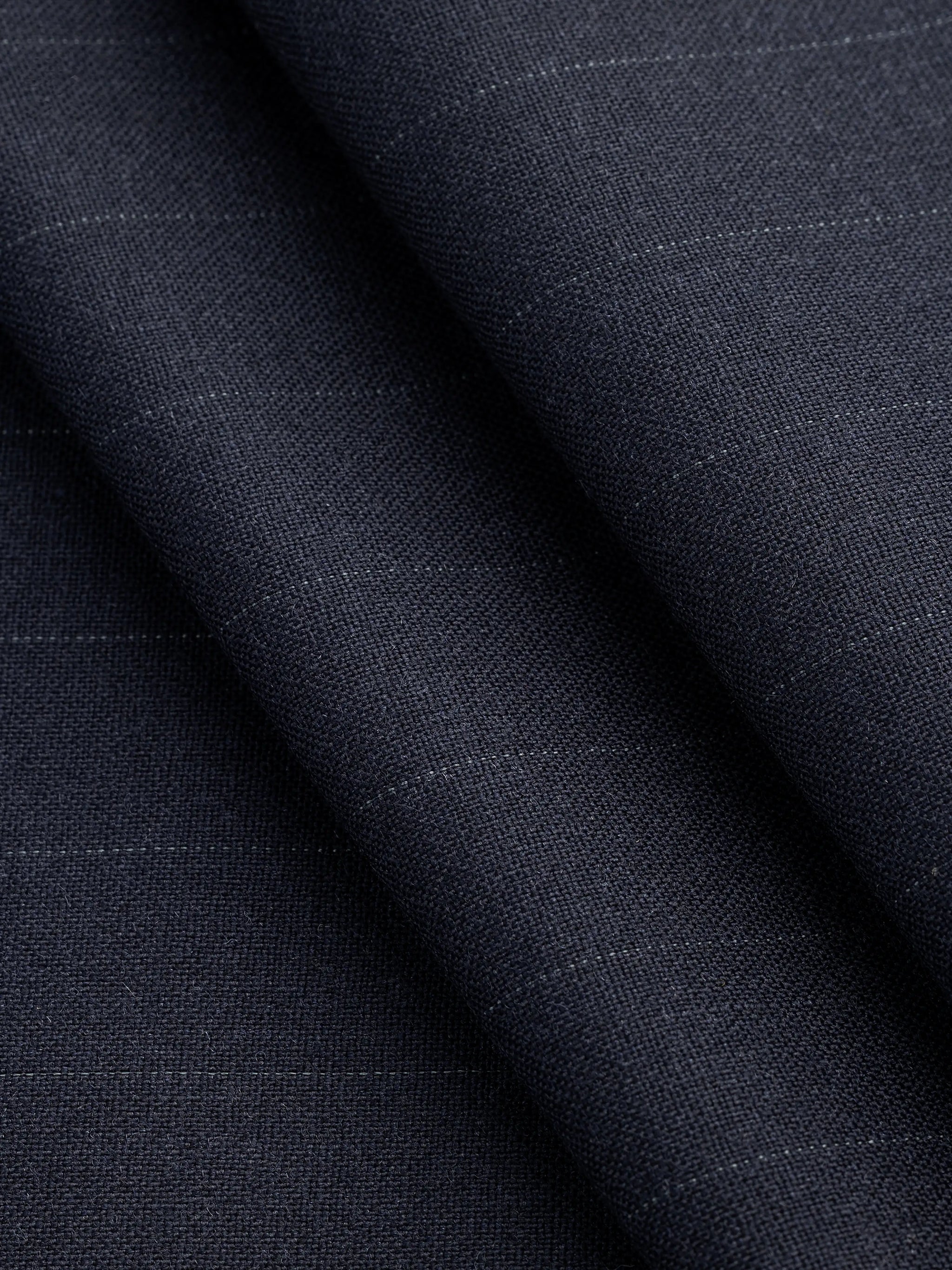 F-WOL105-Subtle-Pinstripe-Italian-Wool-Suiting-Deadstock-Navy-and-White-Core-Fabrics-fold.webp