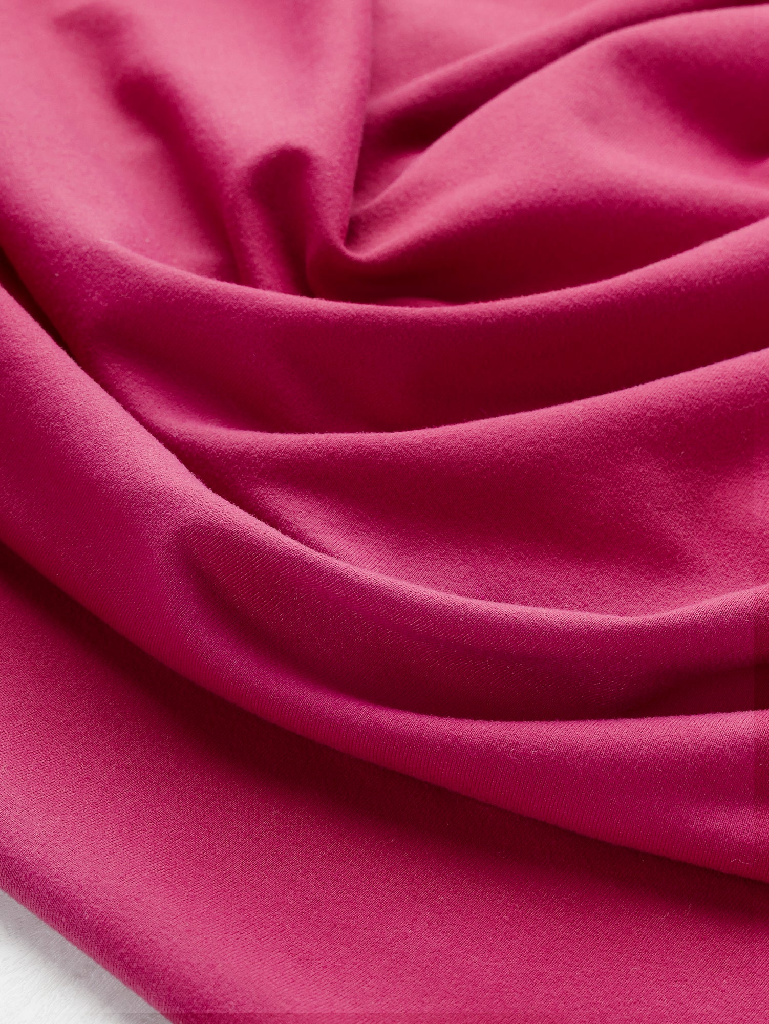 F-DEA106-Supplex-Stretch-Knit-Deadstock-Raspberry-Core-Fabrics-scrunching.JPG