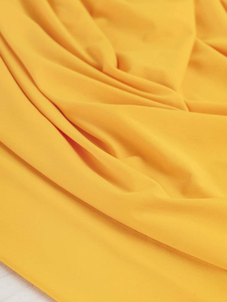 Maille extensible haute performance pour maillot – Fin de rouleau – Mangue