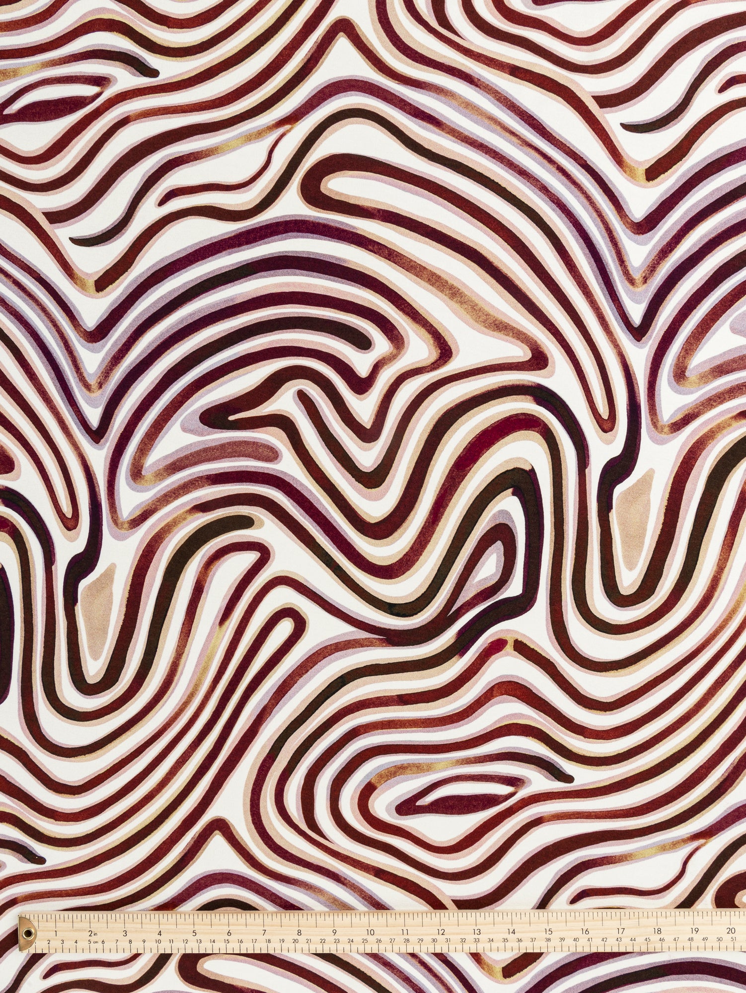 F-VIS270-Swirl-Scene-Print-Viscose-Knit-Brown-Cream-Core-Fabrics-ruler.JPG