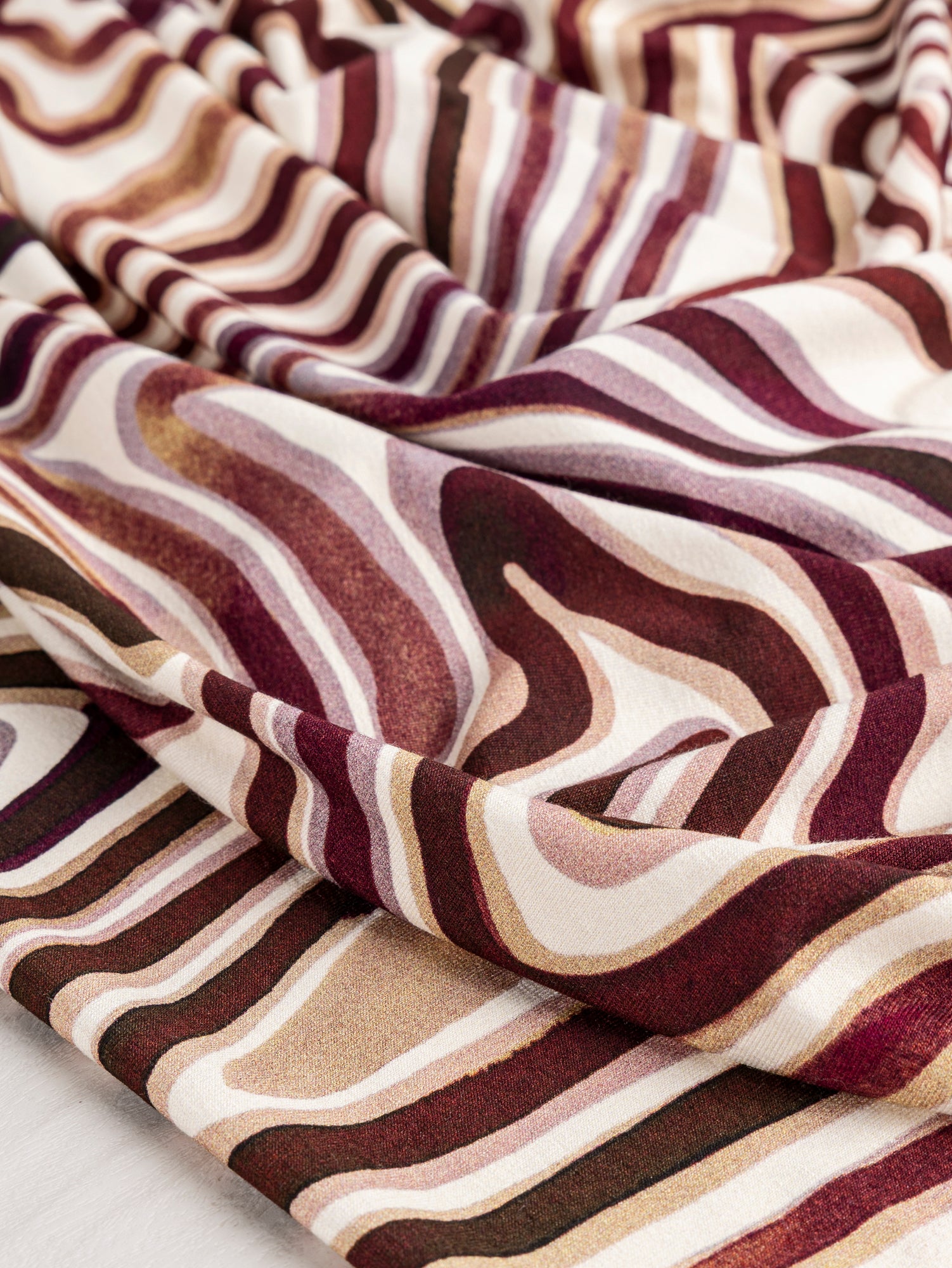 F-VIS270-Swirl-Scene-Print-Viscose-Knit-Brown-Cream-Core-Fabrics-scrunched-2.JPG