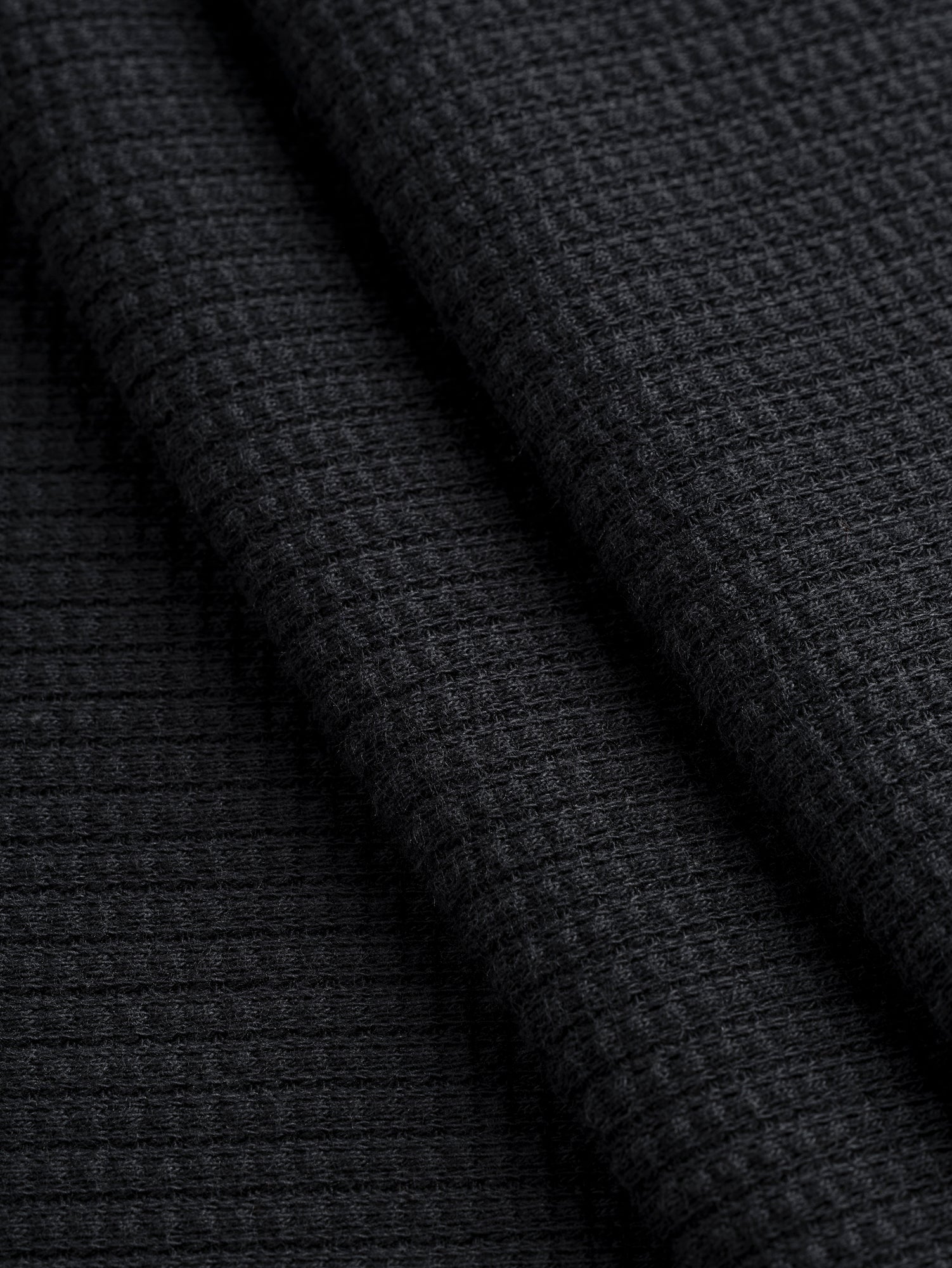 F-DEA093-Tencel-Blend-Stretch-Waffle-Knit-Deadstock-Black-Core-Fabrics-fold.JPG