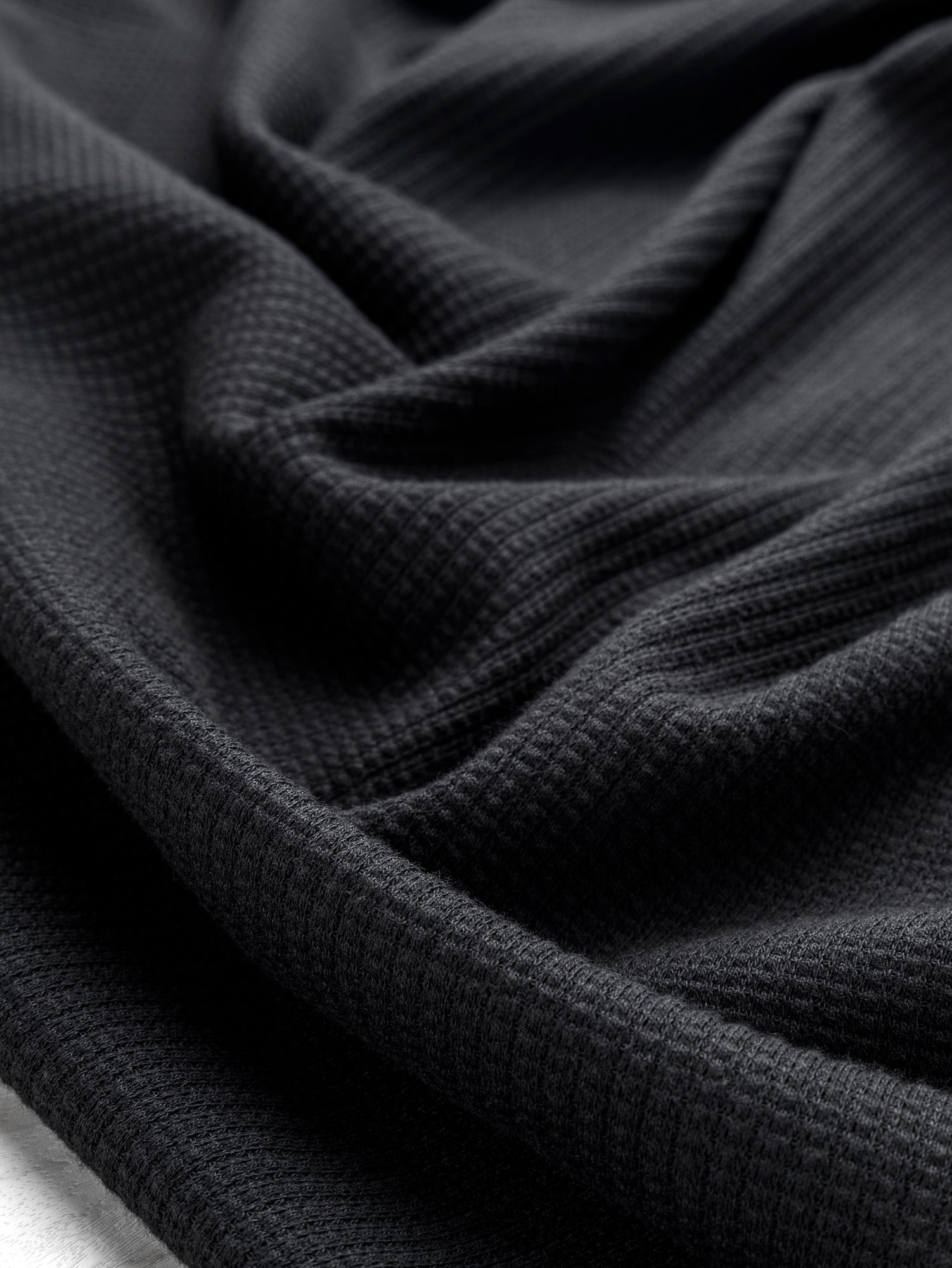 F-DEA093-Tencel-Blend-Stretch-Waffle-Knit-Deadstock-Black-Core-Fabrics-scrunched.JPG