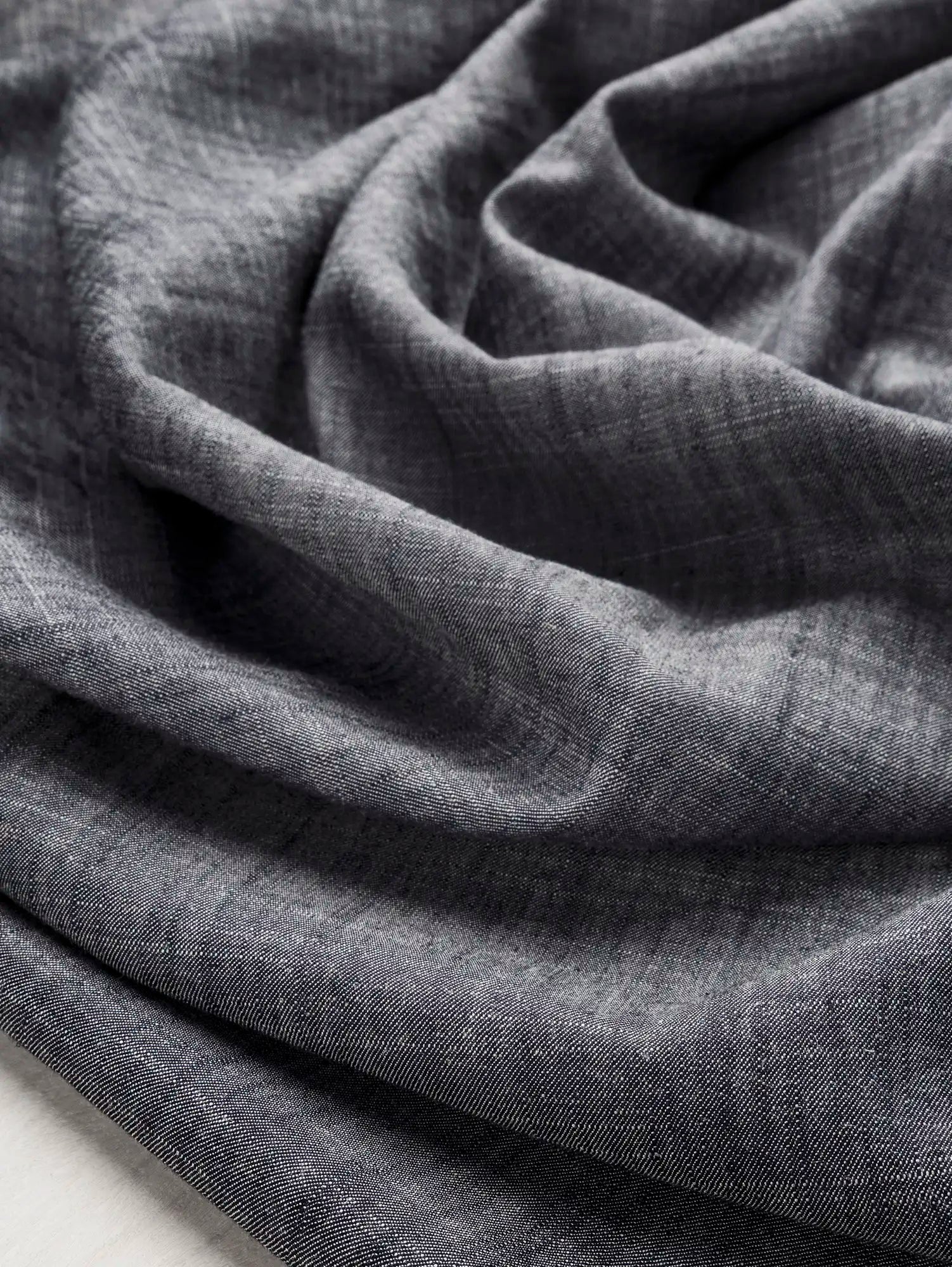 F-DEA212-Tencel-Linen-Chambray-Deadstock-Stone-Core-Fabrics-scrunched.webp