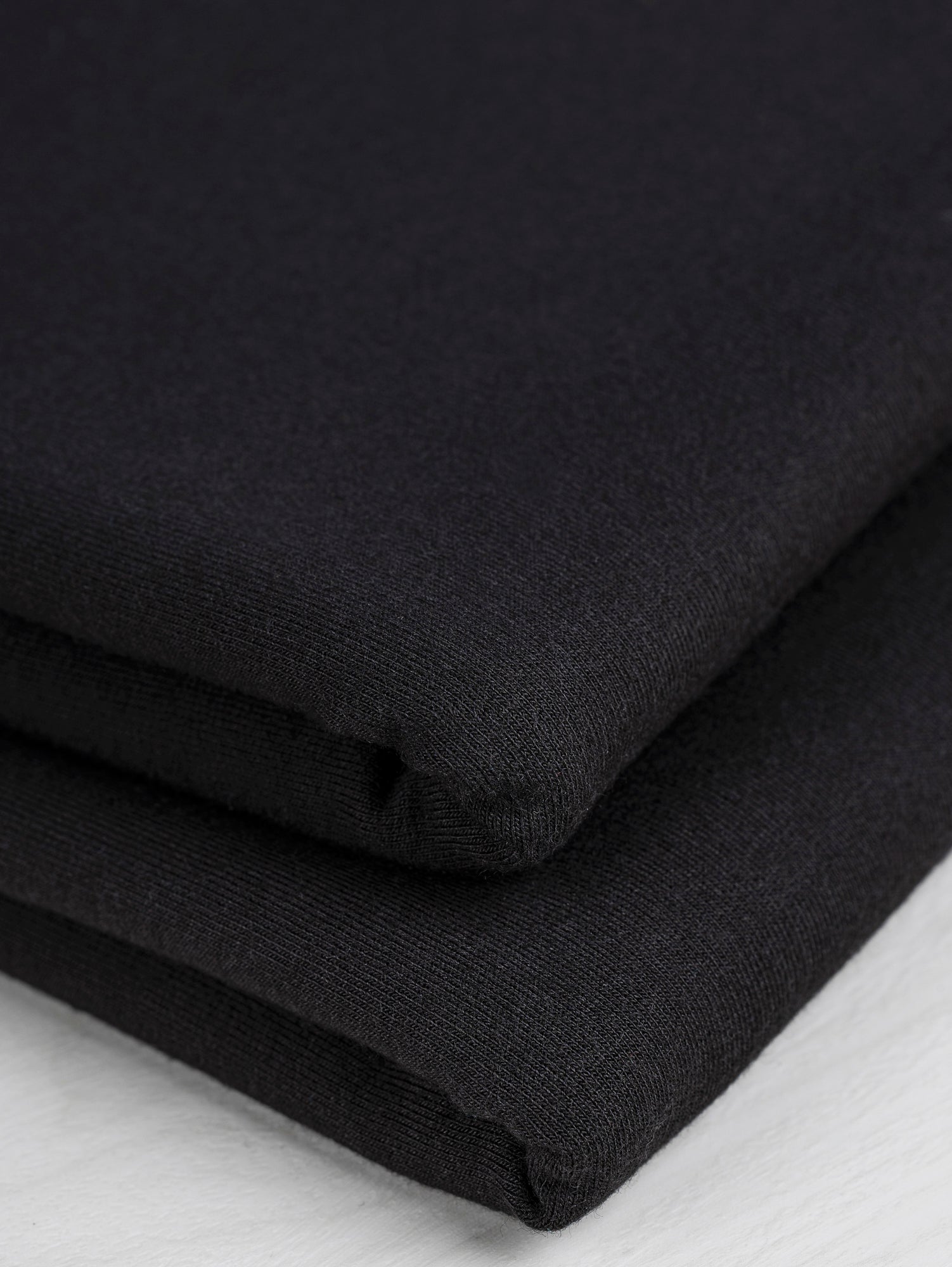 F-TEN014-001-Tencel-Lyocell-Organic-Cotton-Stretch-French-Terry-Black-Core-Fabrics-fold