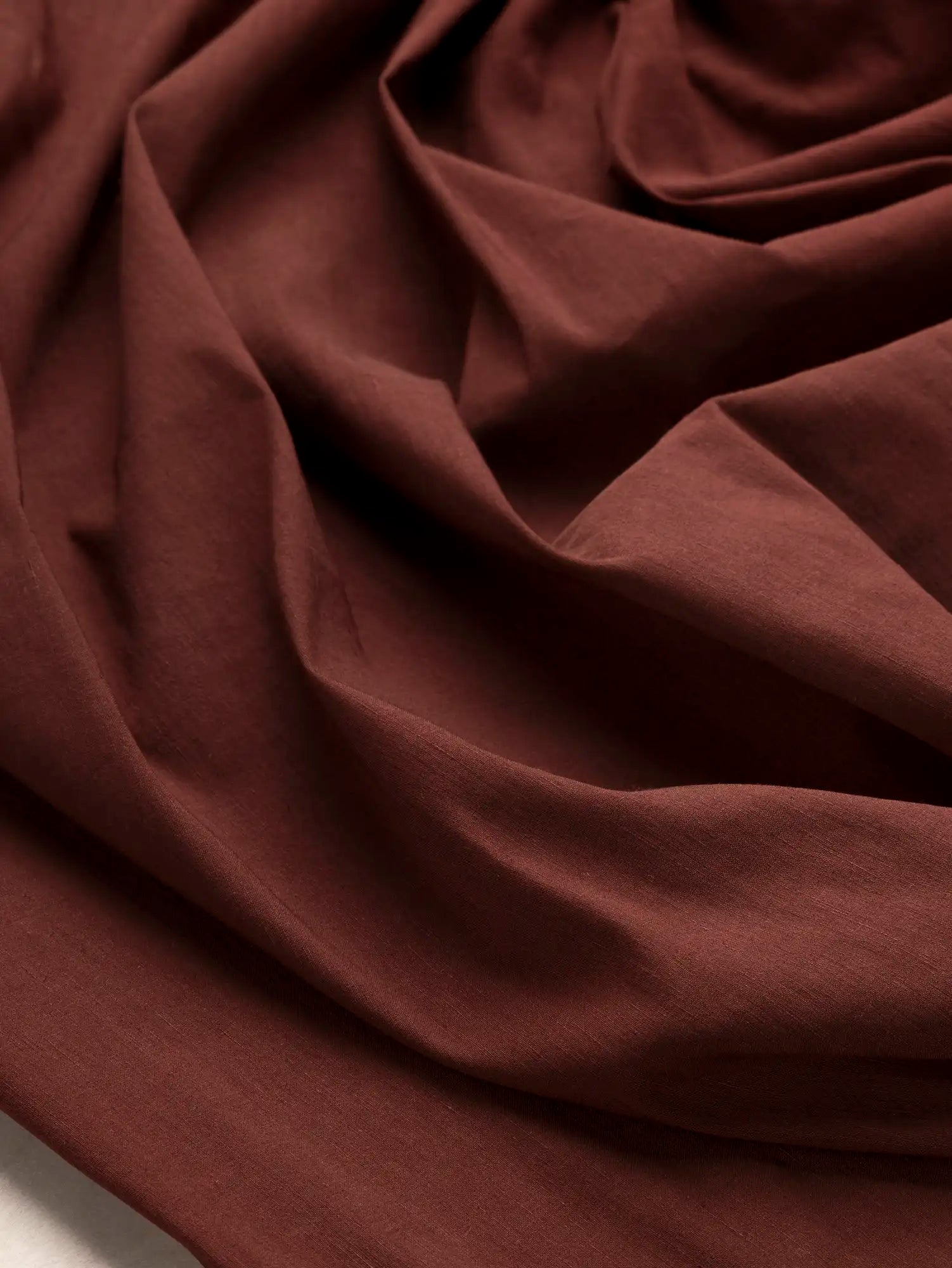 F-DEA240-Textured-Cotton-Spandex-Deadstock-Bordeaux-Core-Fabrics-scrunched.webp