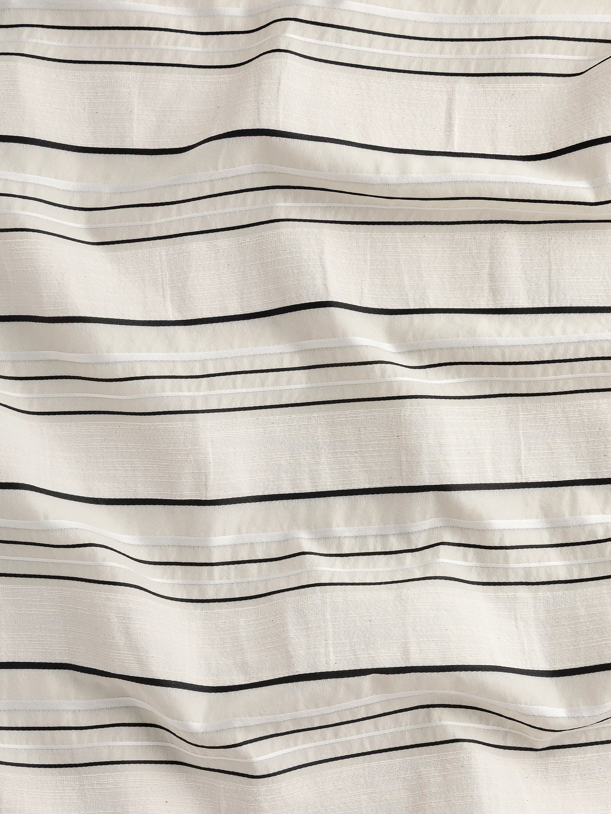 F-DEA145-Textured-Stripe-Cotton-Deadstock-Cream-White-and-Black-Core-Fabrics-scrunched.webp