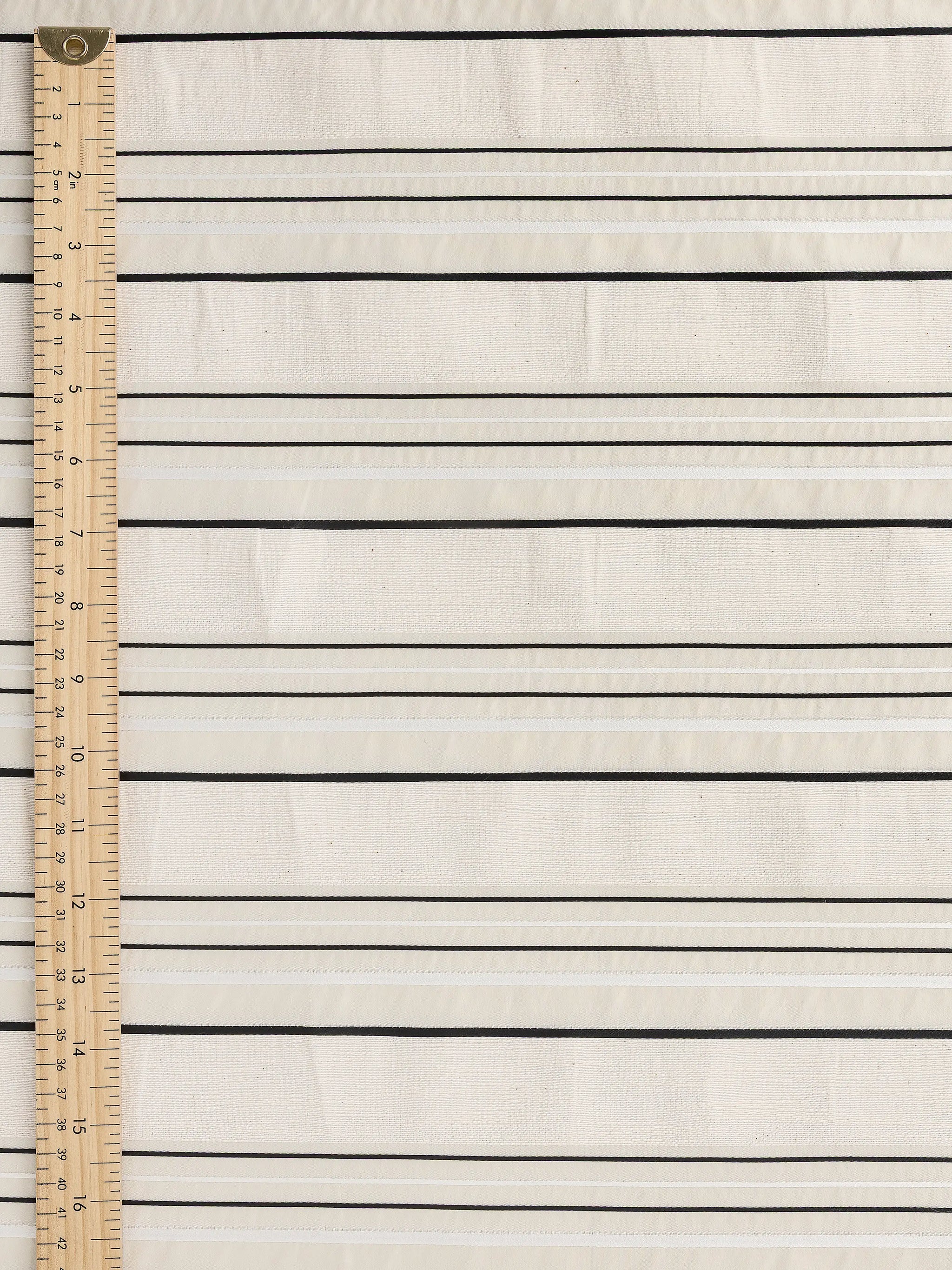 F-DEA145-Textured-Stripe-Cotton-Deadstock-Cream-White-and-Black-Core-Fabrics-ruler.webp