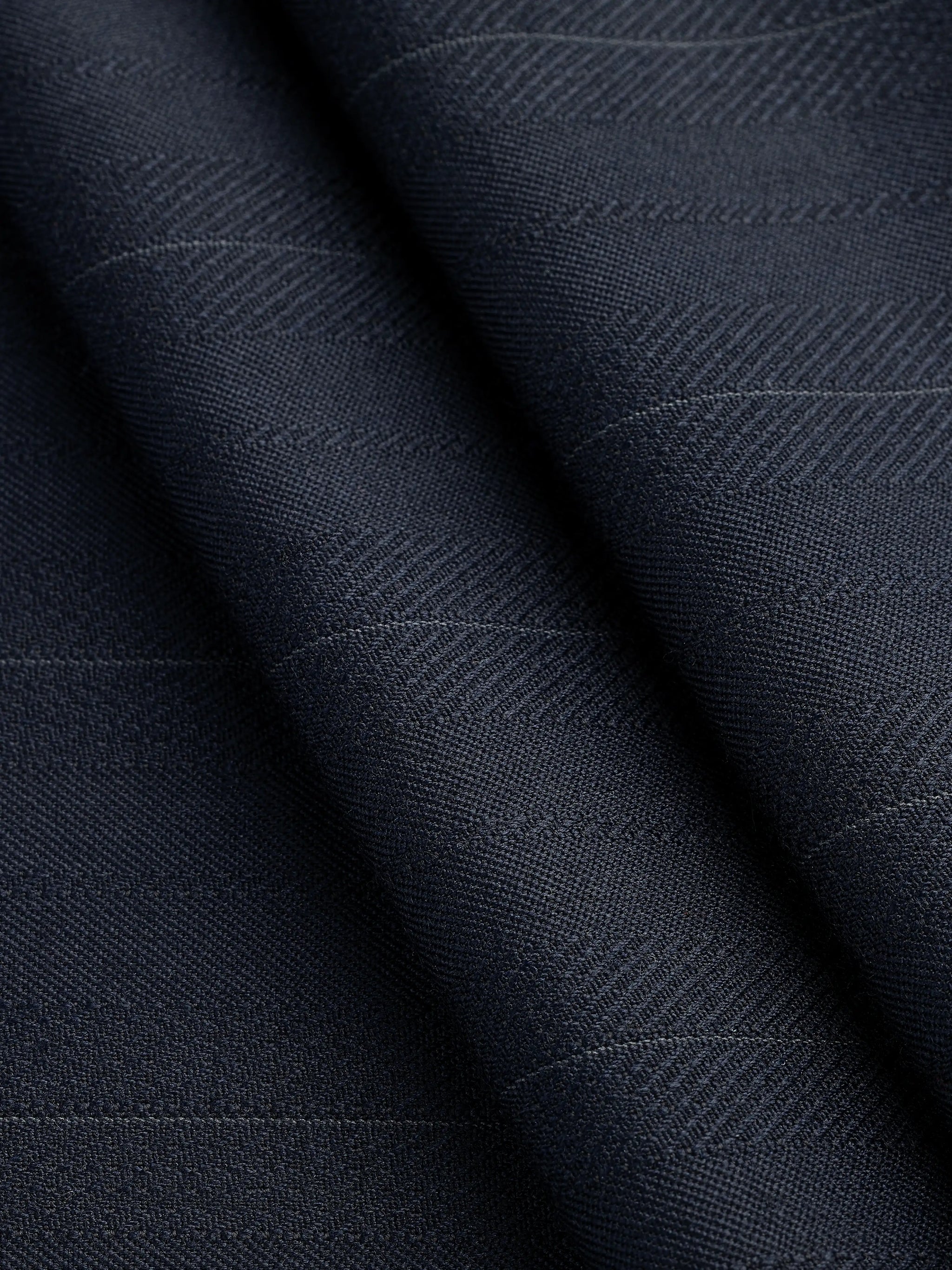 F-WOL118-Textured-Stripe-Italian-Wool-Suiting-Deadstock-Navy-Core-Fabrics-fold.webp