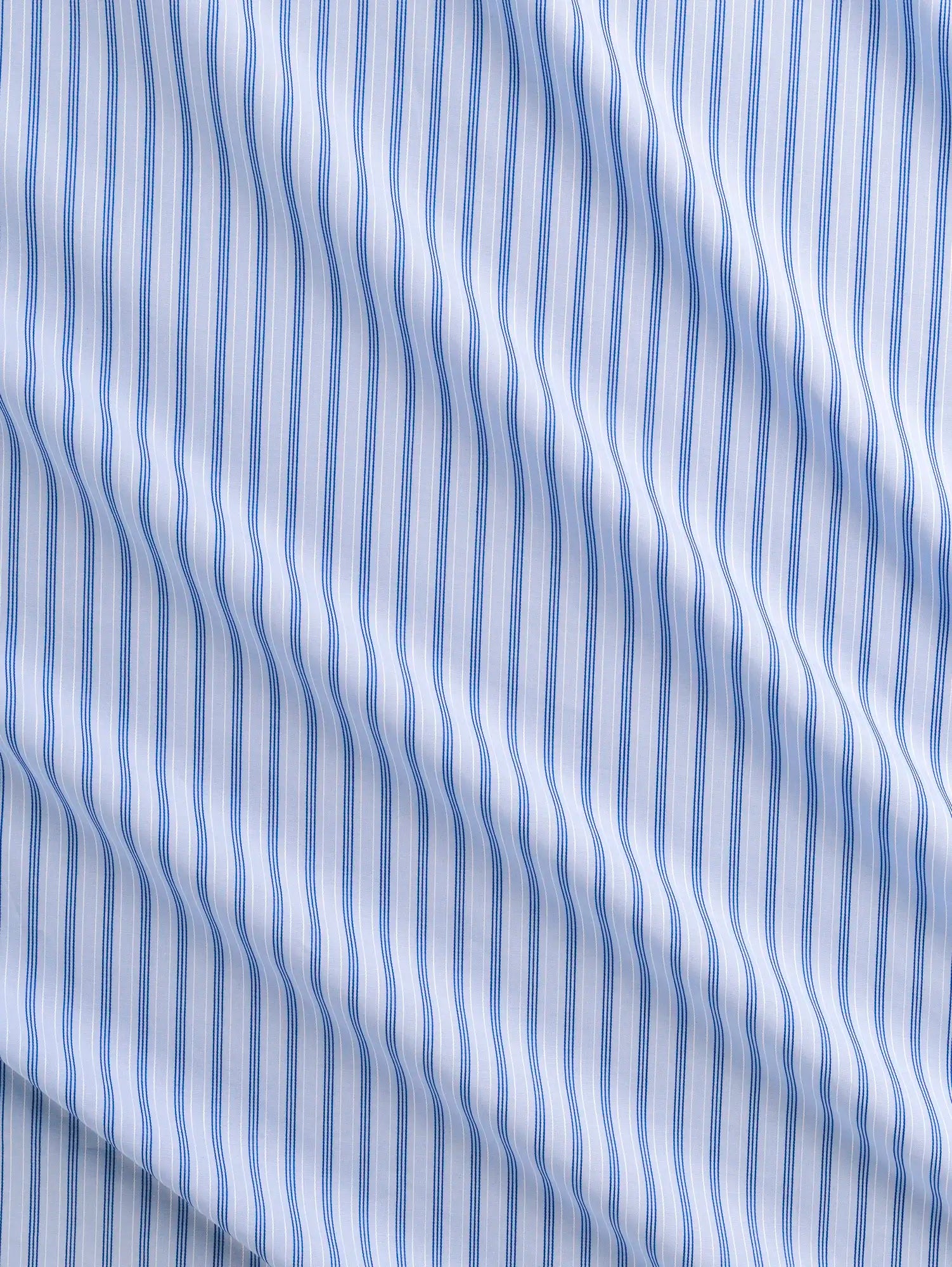 F-COT456-002-Textured-Stripe-Organic-Cotton-Shirting-Sky-Ocean-and-White-Core-Fabrics-scrunched.webp
