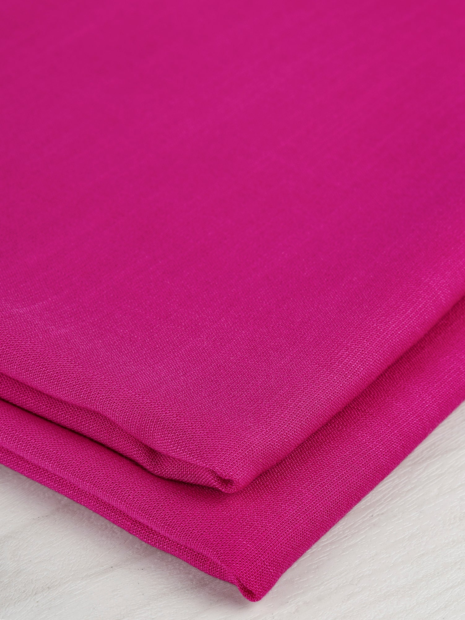 F-DEA049-Textured-Viscose-Linen-Deadstock-Hot-Pink-Core-Fabrics-fold.JPG