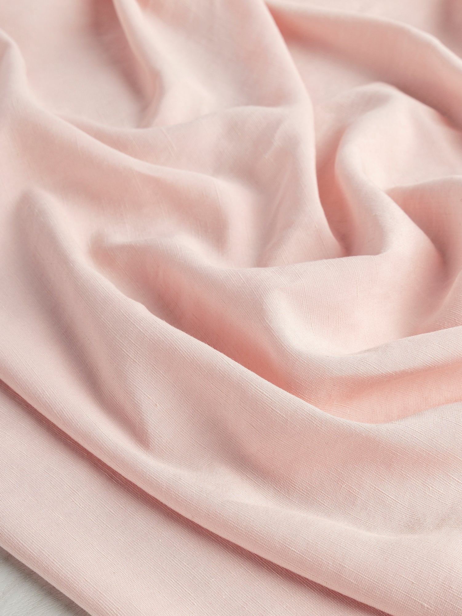 F-DEA054-002-Textured-Viscose-Linen-Deadstock-Powder-Pink-Core-Fabrics-scrunched.JPG